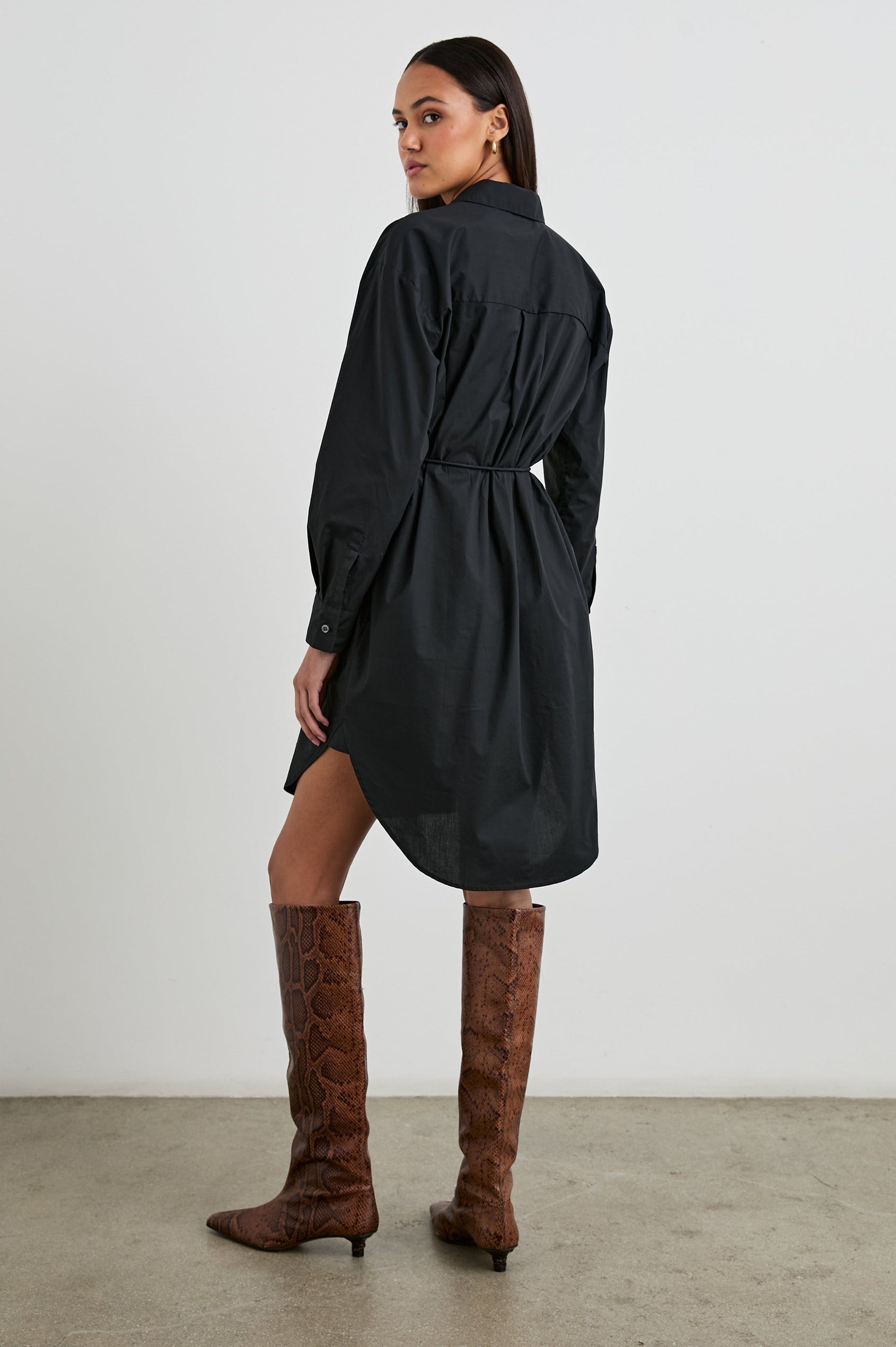 Harmony Long-Sleeve Mini Dress with Buttons Down the Front, Buttoned Cuffs, a Collar, Side Slits and a Tie at the Waist in Black Colorway - Back Full Body View Featured on Model