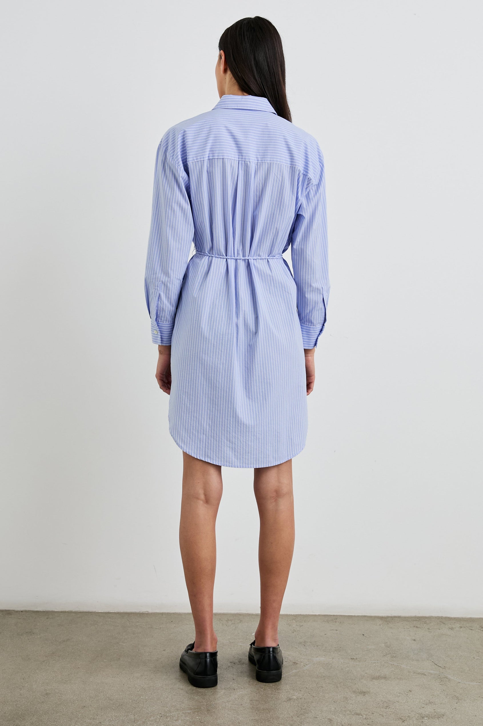 Harmony Long-Sleeve Mini Dress with Buttons Down the Front, Buttoned Cuffs, a Collar, Side Slits and a Tie at the Waist in Oxford White Stripe Colorway, Vertical Blue and White Stripes - Back Full Body View Featured on Model