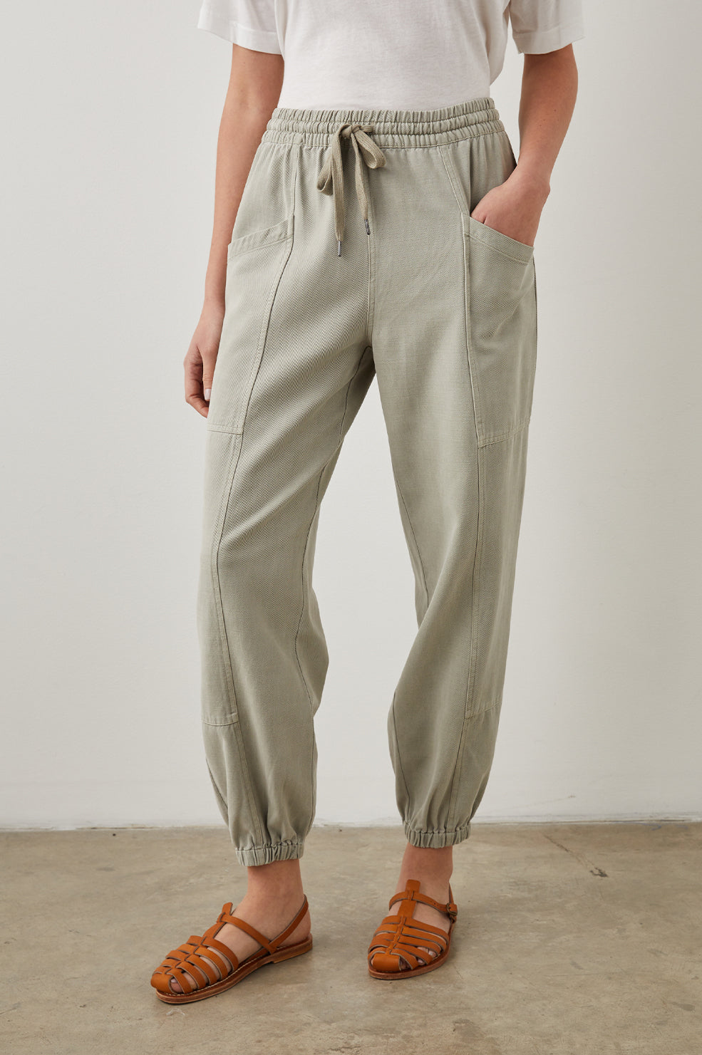 Haven Pants with a Drawstring Waist, Front Seams, Elasticized Hems, Two Front Pockets and Two Back Welt Pockets in Sage Colorway - Front View Featured on Model 