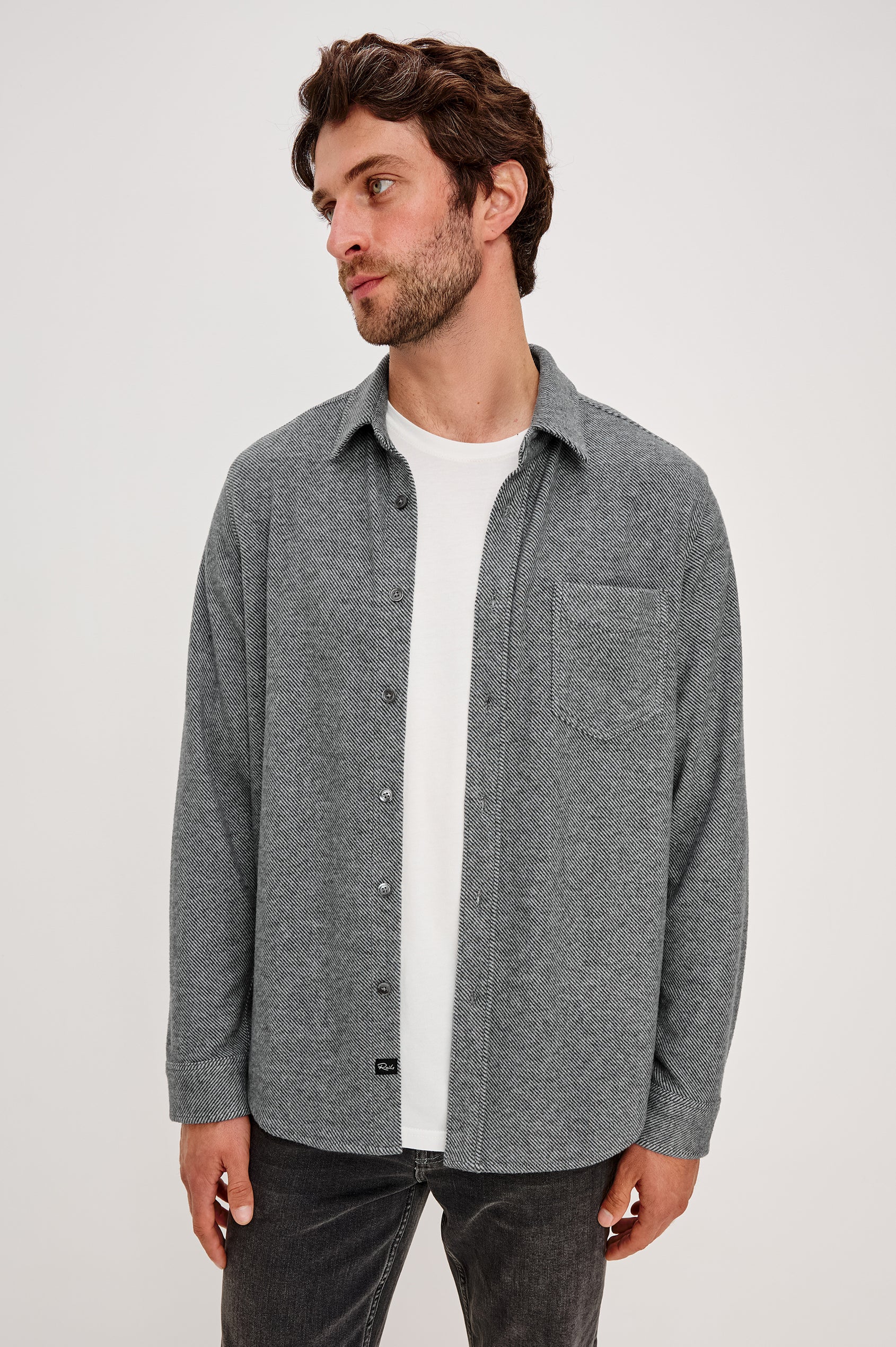 Hawke Long Sleeve Button Front Shirt with a Chest Pocket in Charcoal Twill Colorway. Front View Featured on Model.