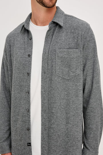 Hawke Long Sleeve Button Front Shirt with a Chest Pocket in Charcoal Twill Colorway. Front Detail View Featured on Model.