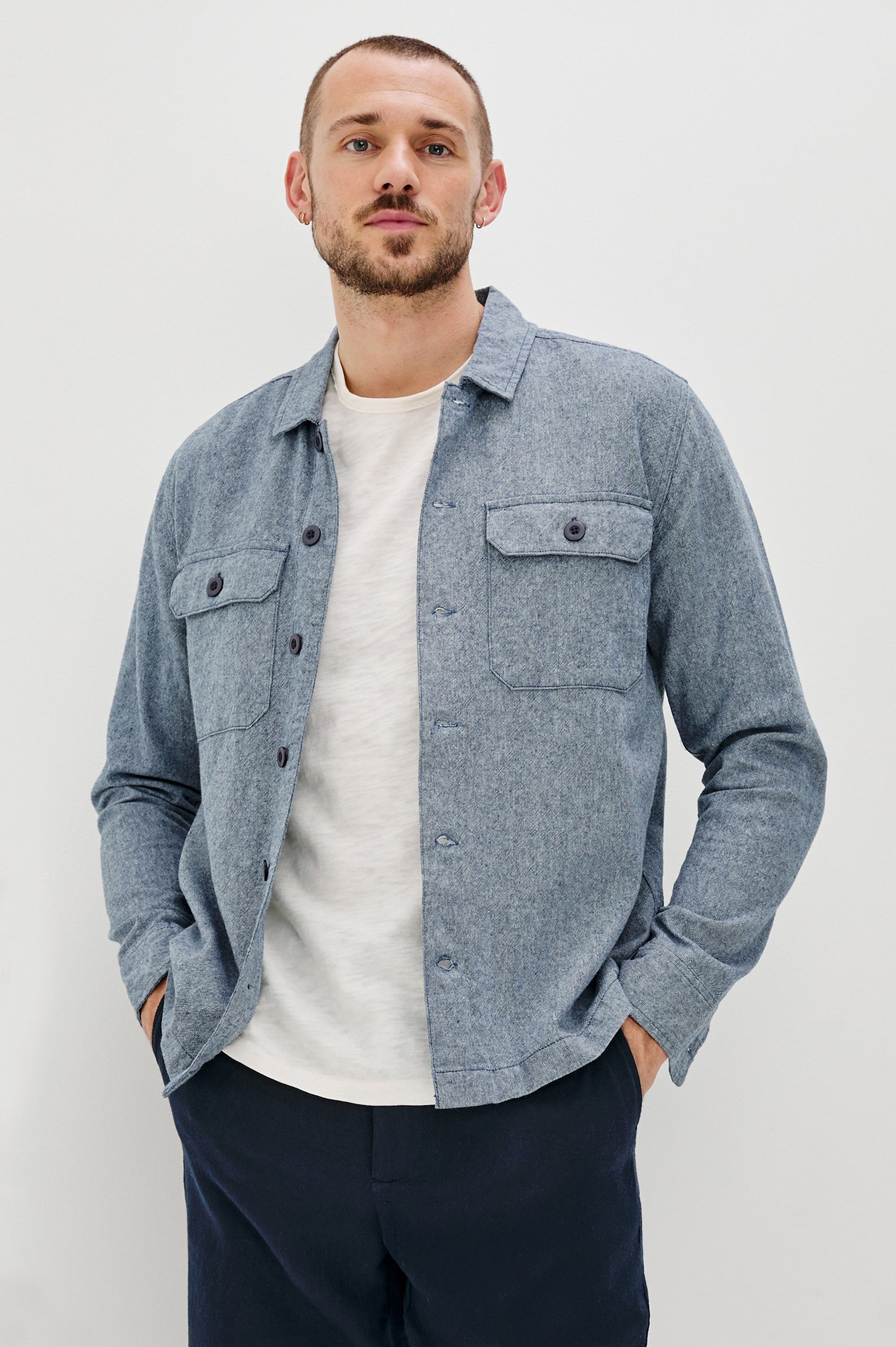 Hayes Shirt Jacket with Long Sleeves and Chest Flap Pockets with Button Closure, Exposed Button Front in Blue Mirage. Front View Shown on Model.