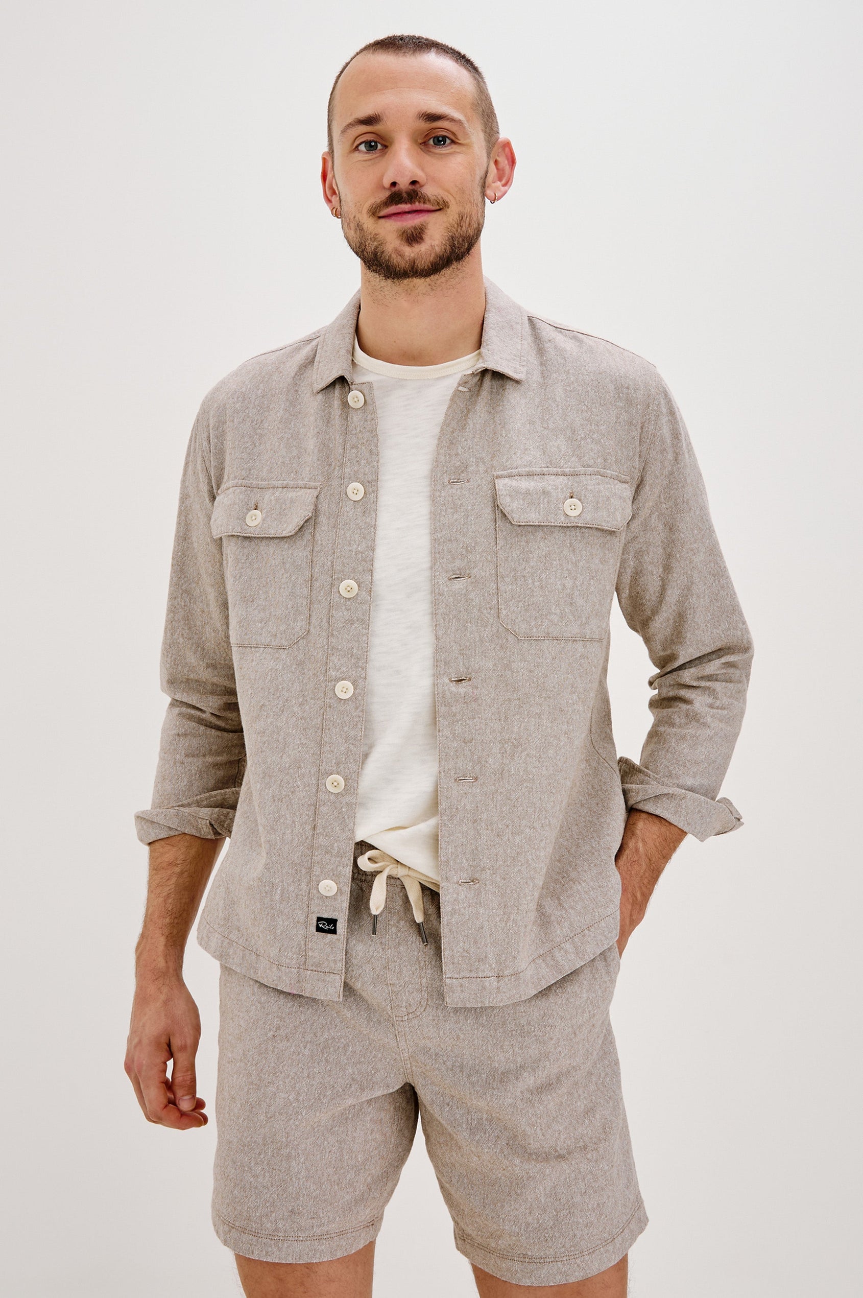 Hayes Shirt Jacket with Long Sleeves and Chest Flap Pockets with Button Closure, Exposed Button Front in Blue Mirage. Front View Shown on Model.