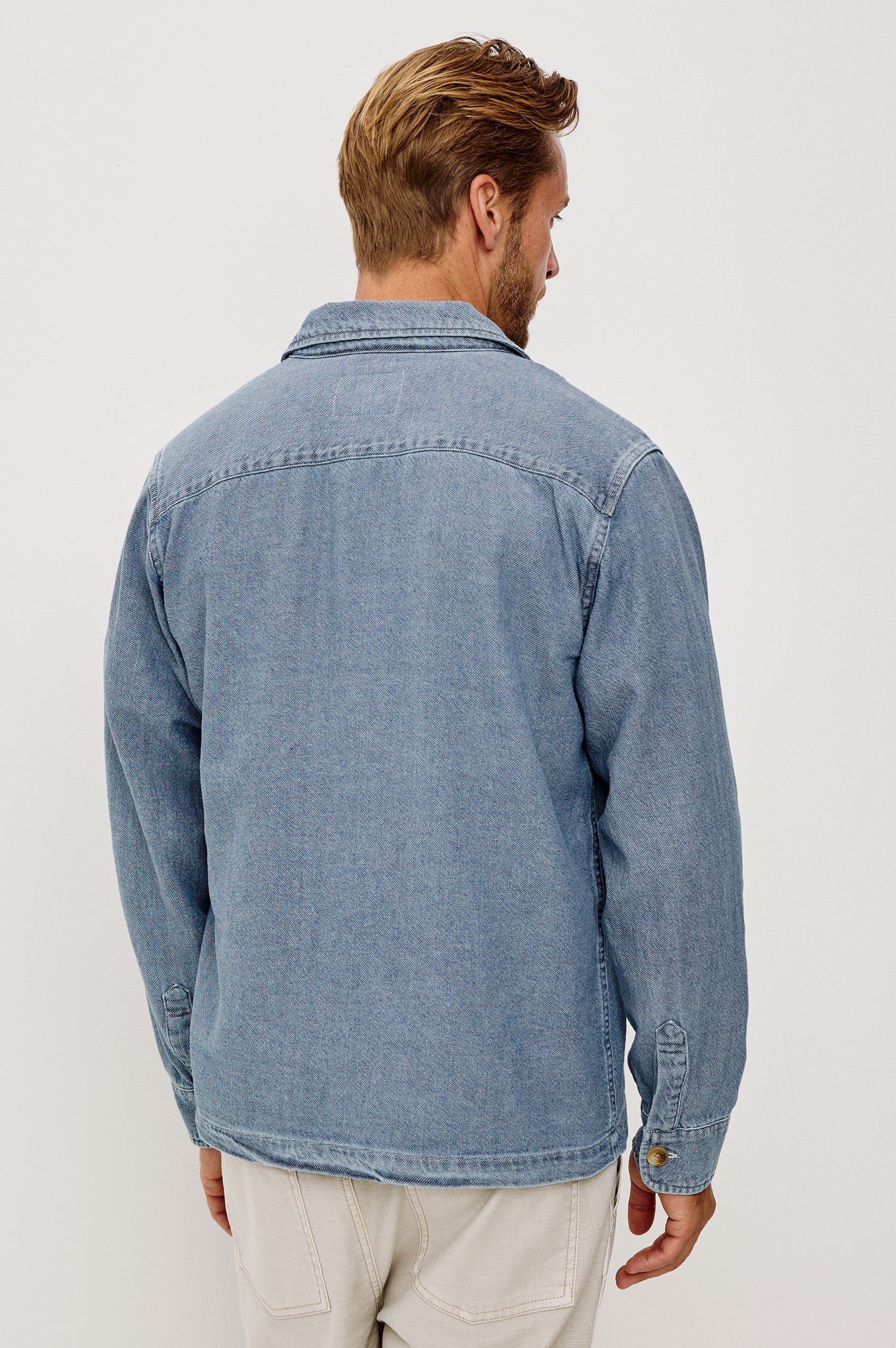 Hayes Shirt Jacket in Linen Cotton Slub With Long Sleeves, Chest Patch Pockets, and Collar in Medium Wash Indigo Colorway - Upper Body Back View Featured on Model