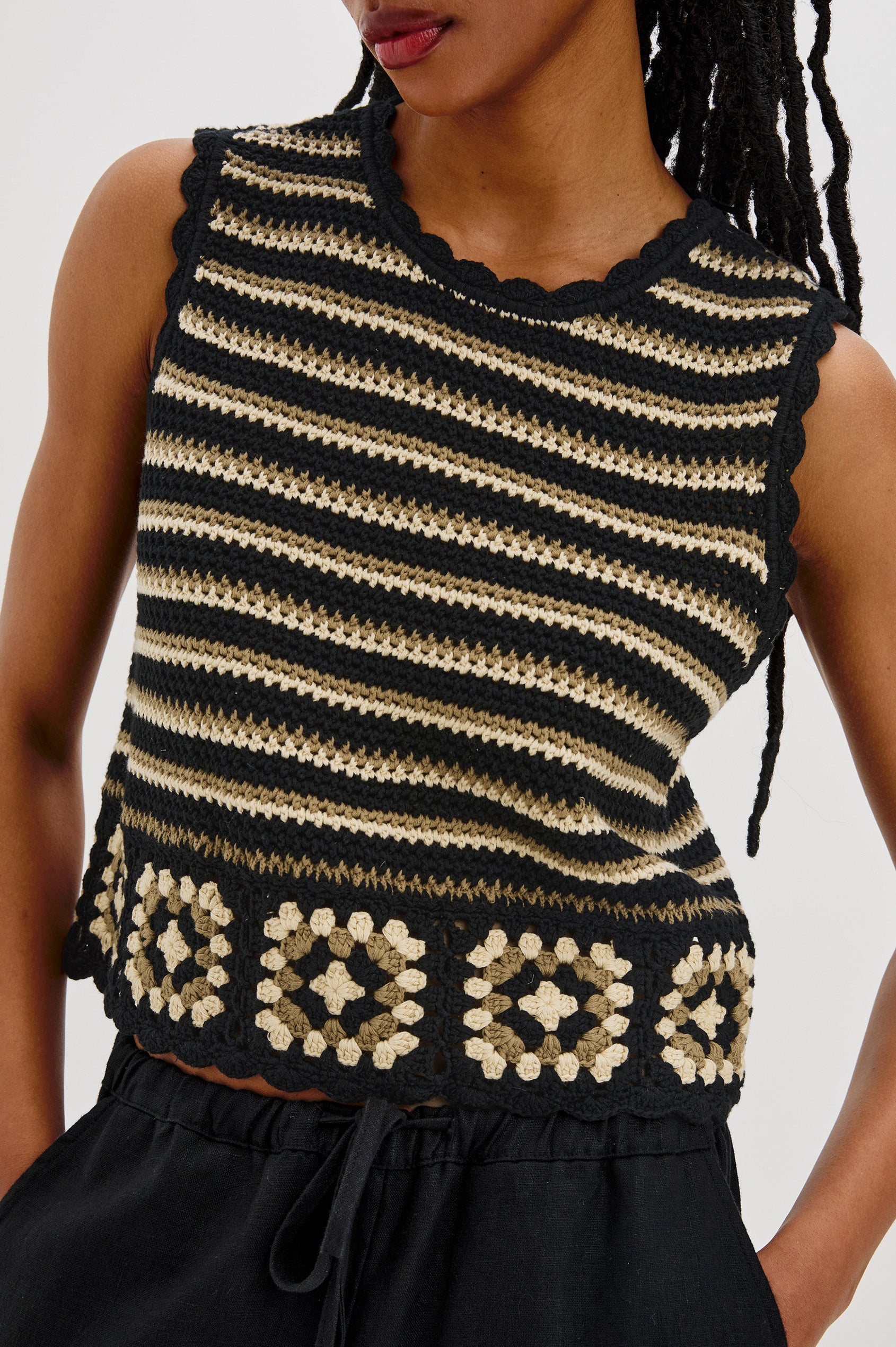 Hazel Crew Neck Crochet Top with Scalloped Hem, Sleeveless in Black and Brown Milos Colorway. Front View Shown on Model.