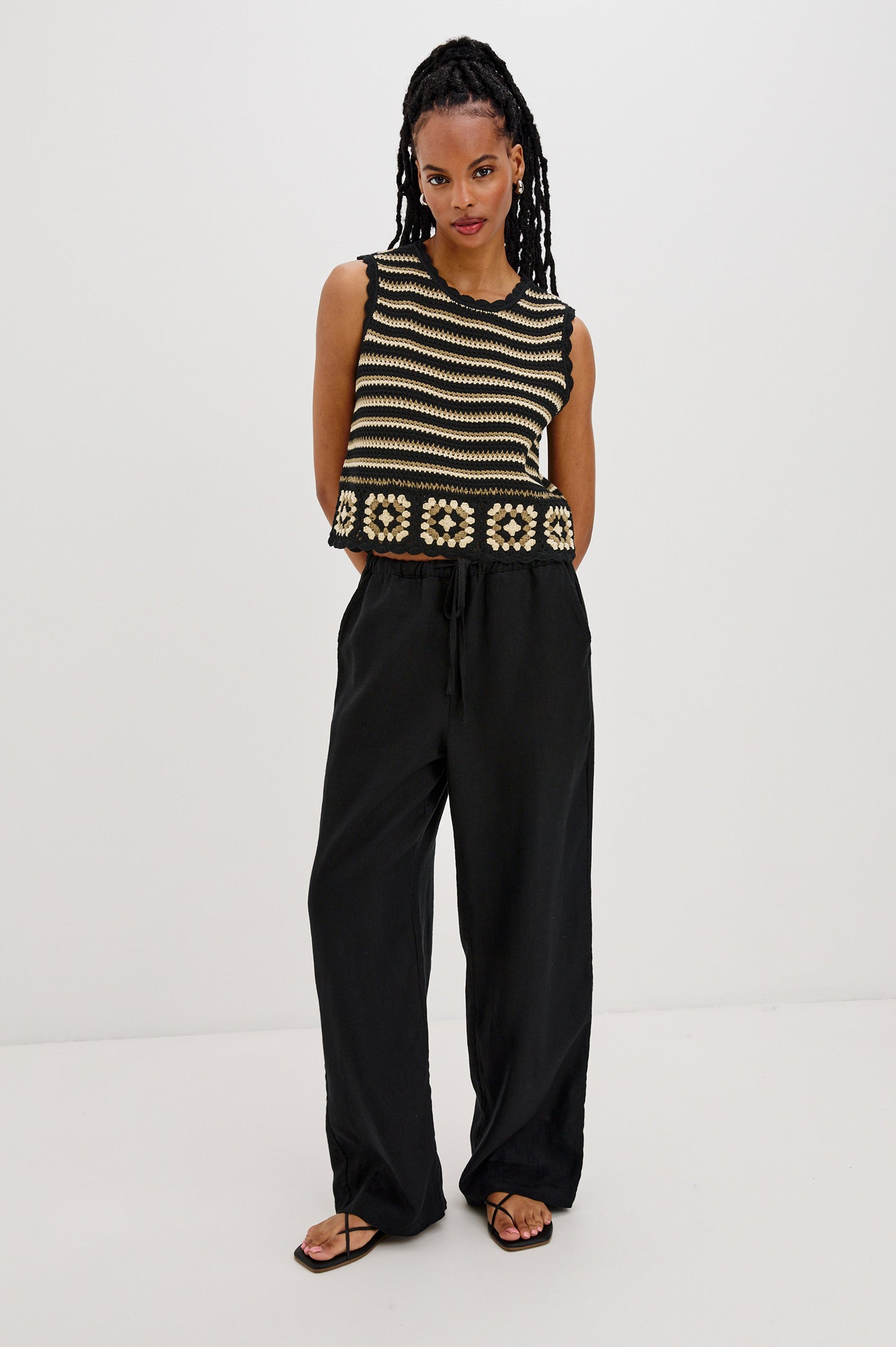 Hazel Crew Neck Crochet Top with Scalloped Hem, Sleeveless in Black and Gold Milos Colorway. Front View Shown on Model.