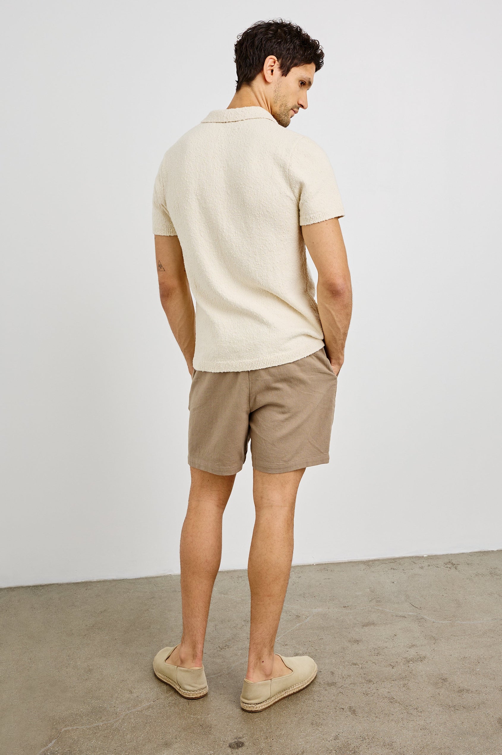 Heath Polo Shirt with Short Sleeves in Cream Colorway. Back View Shown on Model.