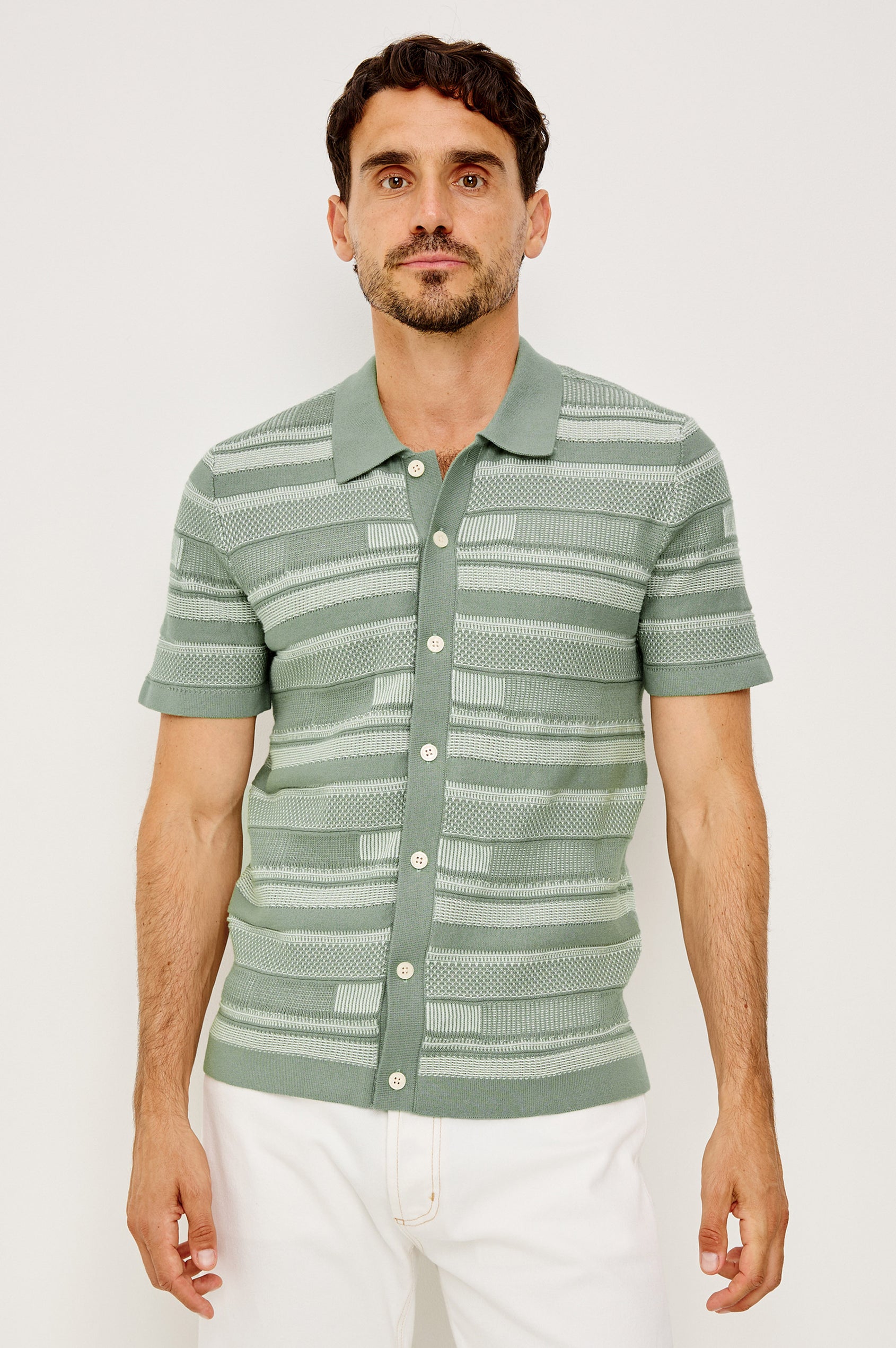 Henri Polo Shirt in Cotton Knit With Collar, Front Buttons, Short Sleeves, and Relaxed Fit in Sage Cream Block Colorway - Upper Body Front View Featured on Model