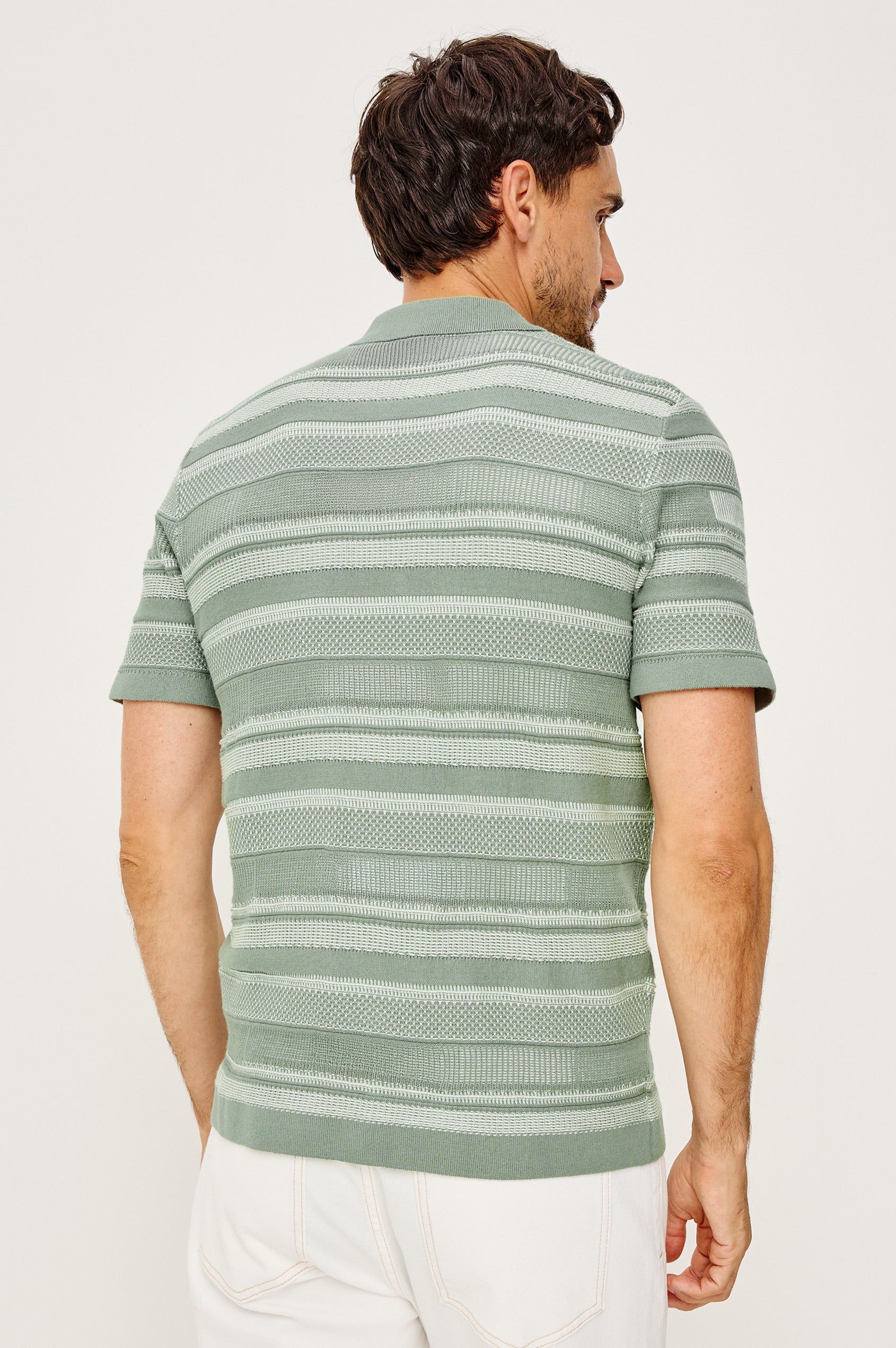 Henri Polo Shirt in Cotton Knit With Collar, Front Buttons, Short Sleeves, and Relaxed Fit in Sage Cream Block Colorway - Upper Body Back View Featured on Model