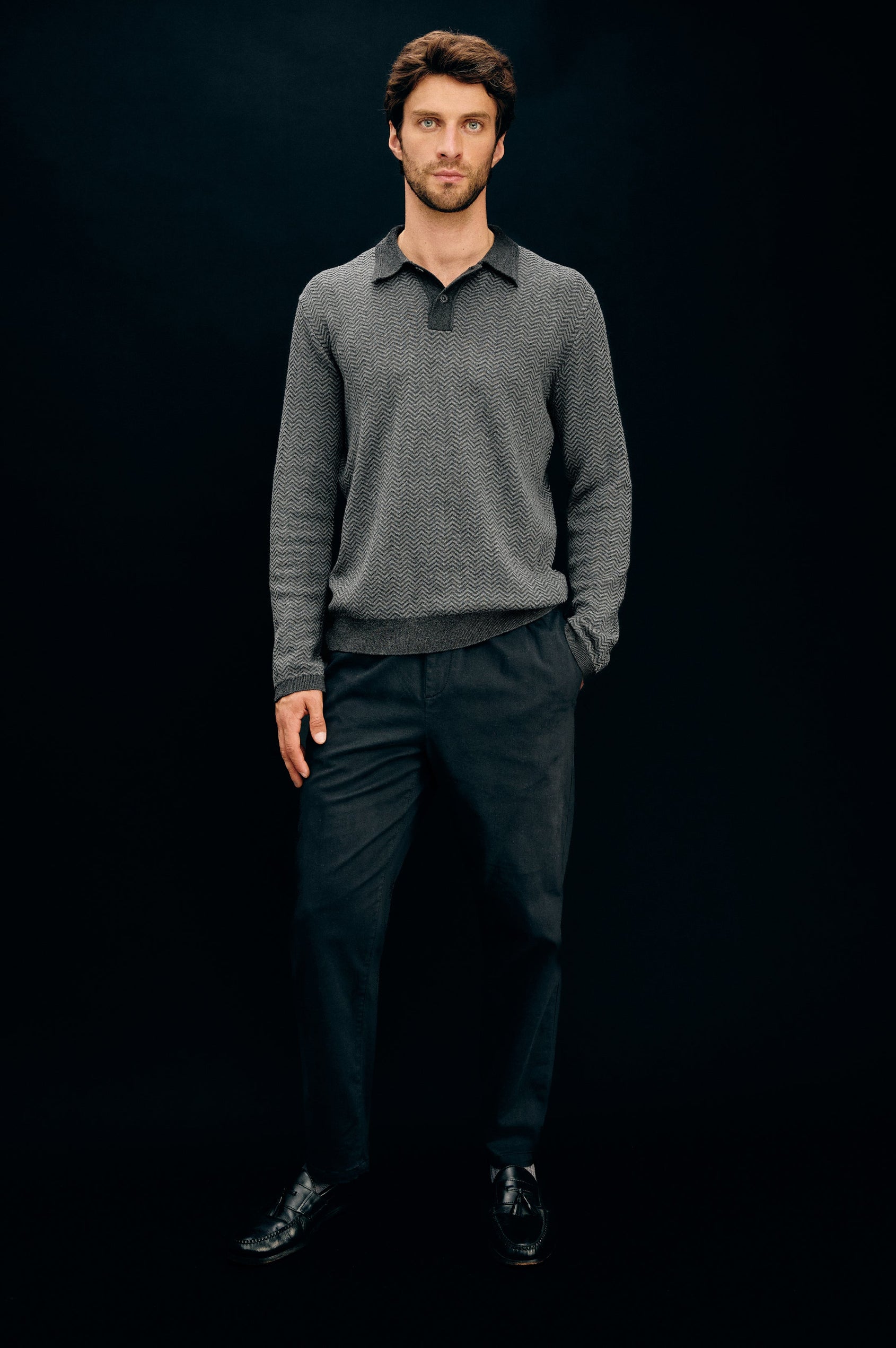 Herrington Long-Sleeve Collared Sweater with a Two Button Placket and a Herringbone Jacquard in Charcoal Herringbone Melange Colorway. Front Full Body View Featured on Model.