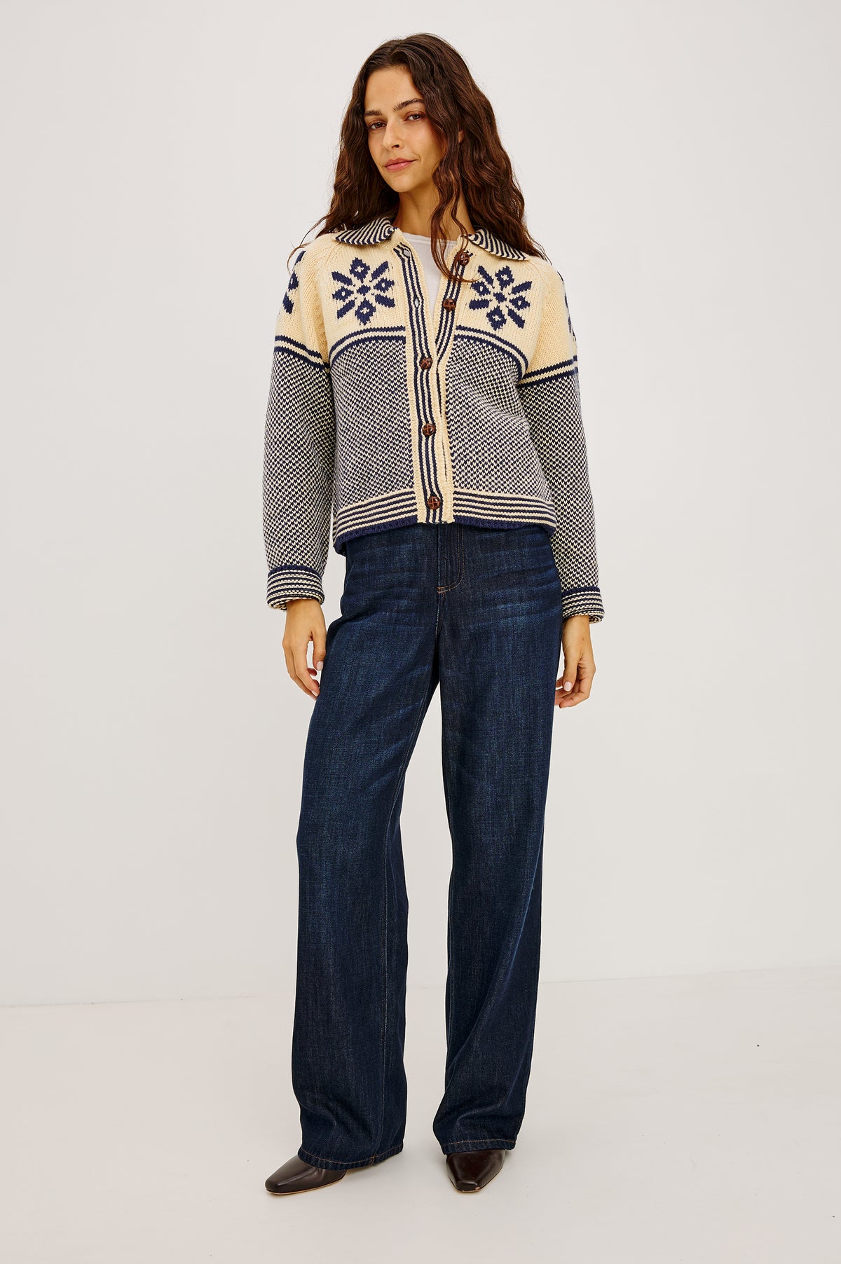 Hilde Cardigan in Fair Isle Jacquard Knit With Relaxed Fit, Wide Collar, Front Buttons, and Long Sleeves in Snowflake Colorway - Full Body Front View Featured on Model.