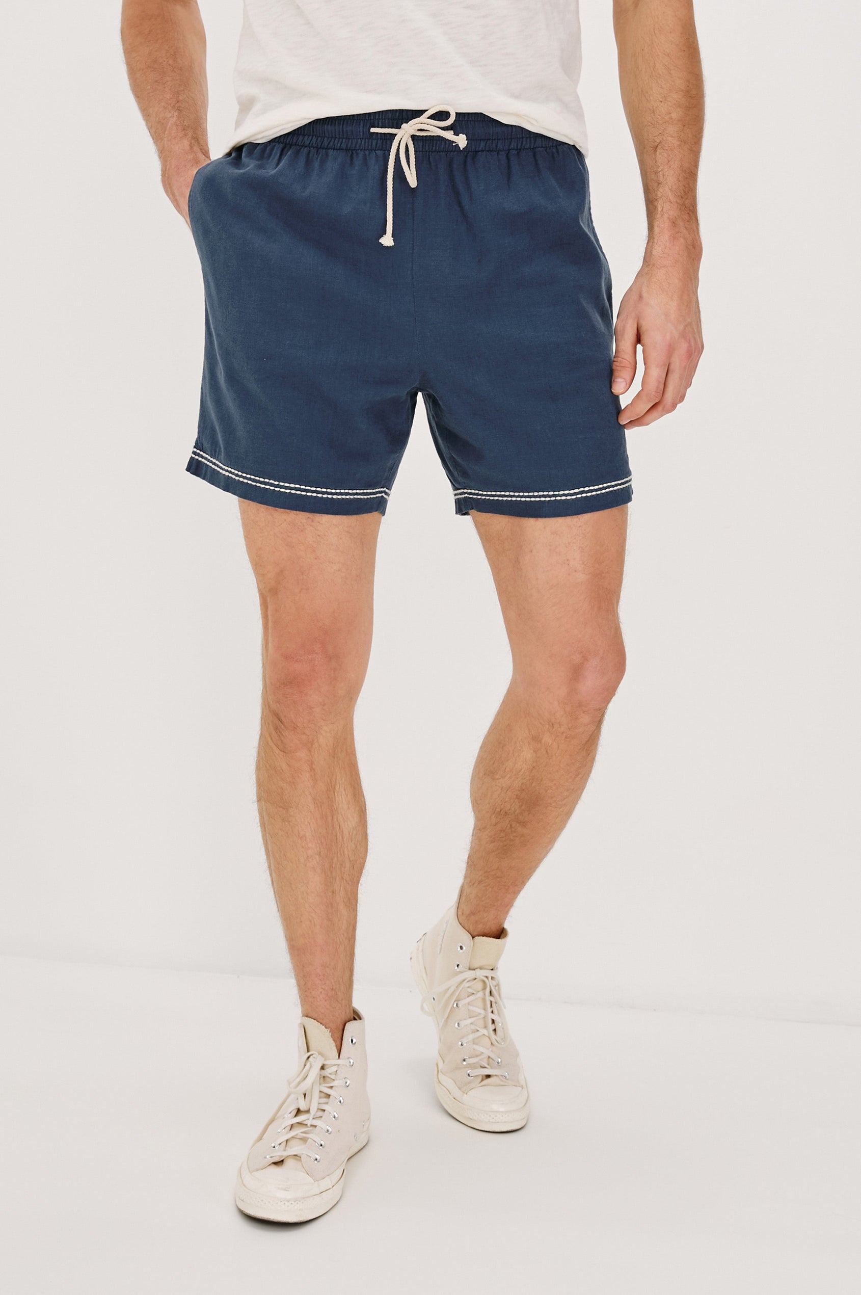Hudson Elastic Waist Short with a Drawstring Waist, Contrast White Stitching and Side Pockets. Front View Shown on Model.
