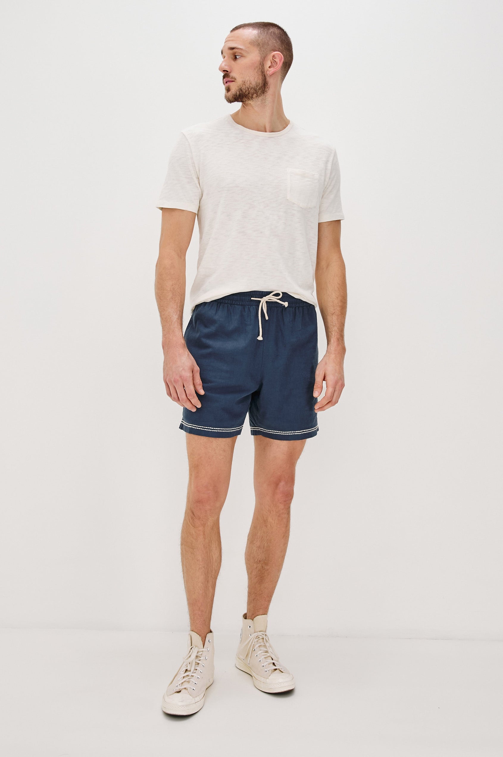 Hudson Elastic Waist Short with a Drawstring Waist, Contrast White Stitching and Side Pockets. Full Body Front View Shown on Model.