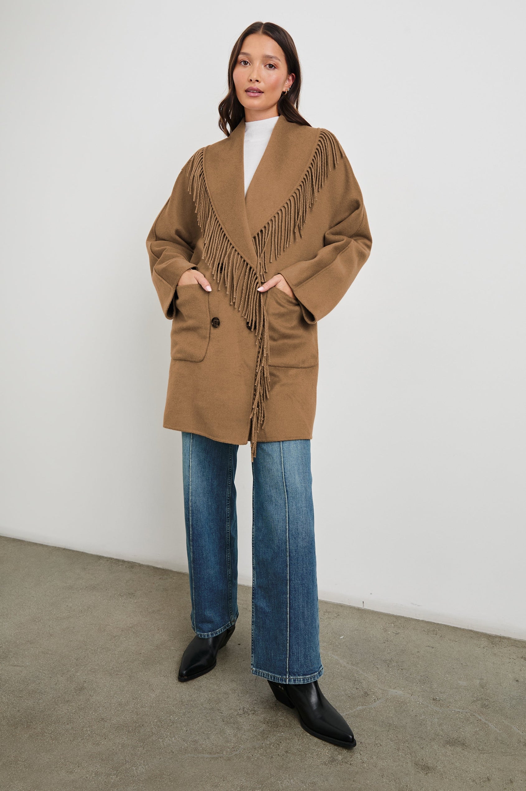 Hugo Double-Breasted, Mid-Thigh Length Coat with Button Closure, Wide Lapels, Two Front Patch Pockets and Fringe along the Lapels and Closure in Camel Colorway - Front Full Body View Featured on Model 