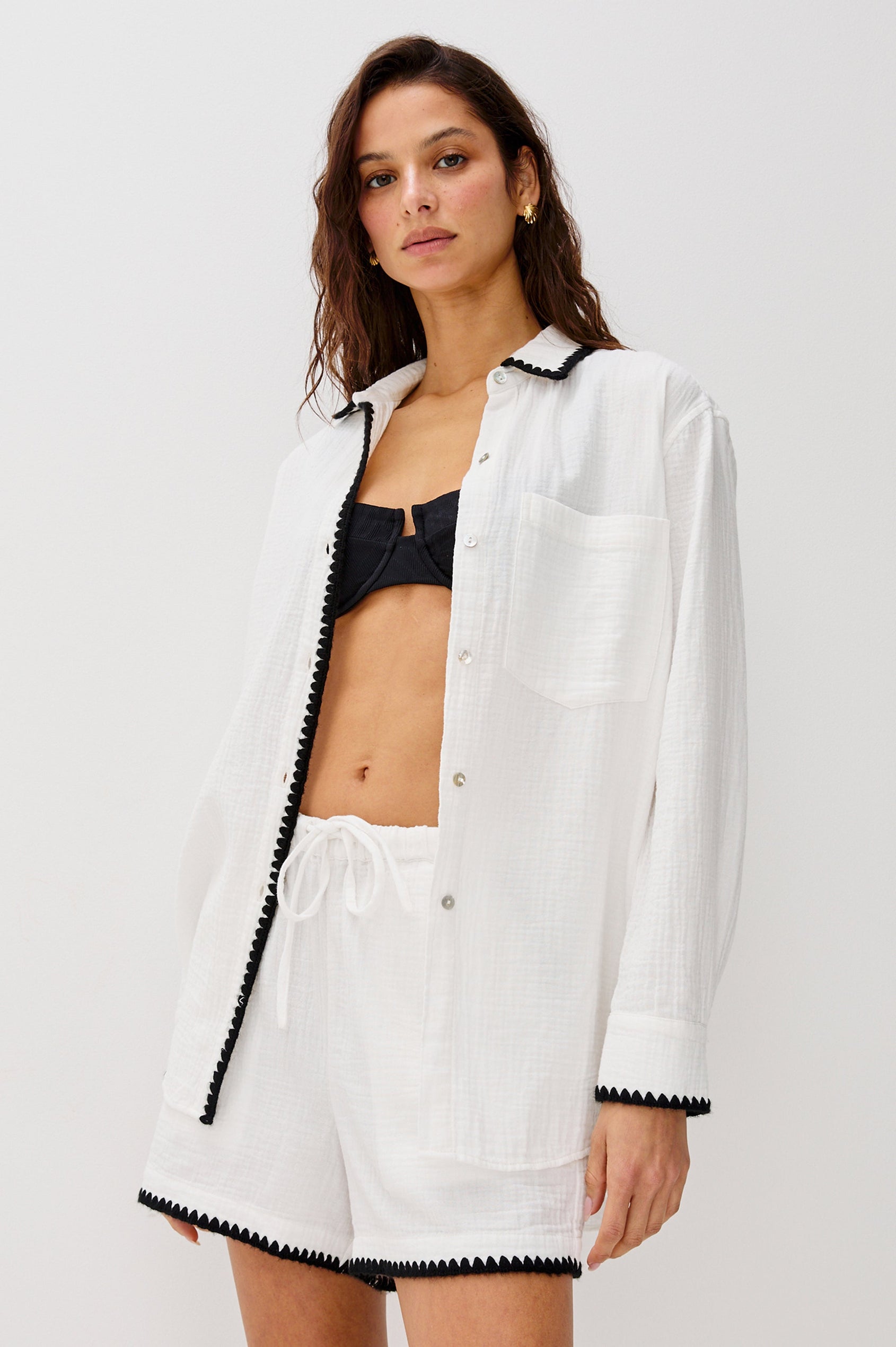 Idania Button Front Collared Shirt with Long Sleeves, Relaxed Fir and a Front Chest Pocket with a White Body in Black Blanket Stich Colorway. Front View Shown on Model.