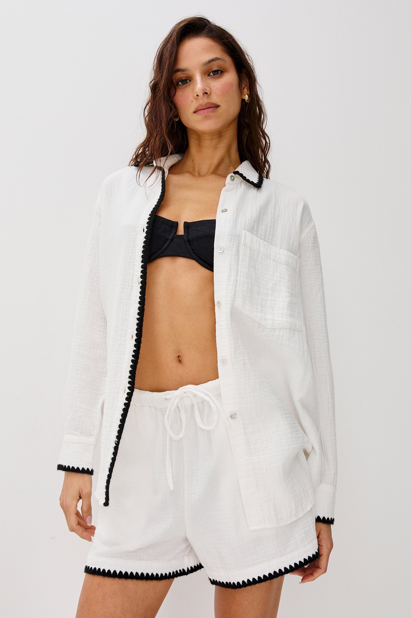 Idania Button Front Collared Shirt with Long Sleeves, Relaxed Fir and a Front Chest Pocket with a White Body in Black Blanket Stich Colorway. Front View Shown on Model.