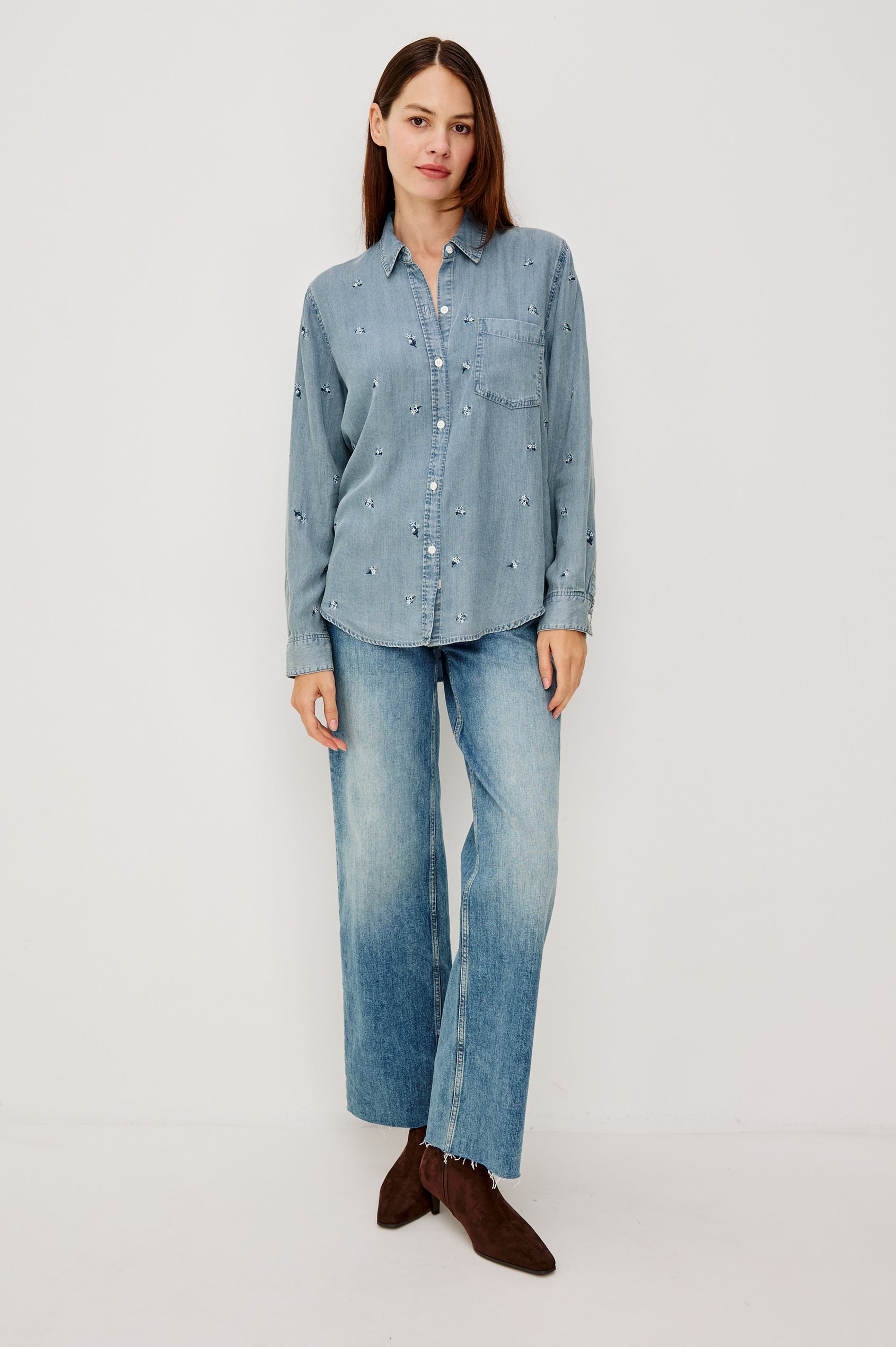 Ingrid Button-Up Collared Shirt in TENCEL™Denim With Vintage-Inspired Wash, Floral Embroidery, a Chest Patch Pocket, and Long Sleeves in Blossoms Colorway - Full Body Front View Featured on Model
