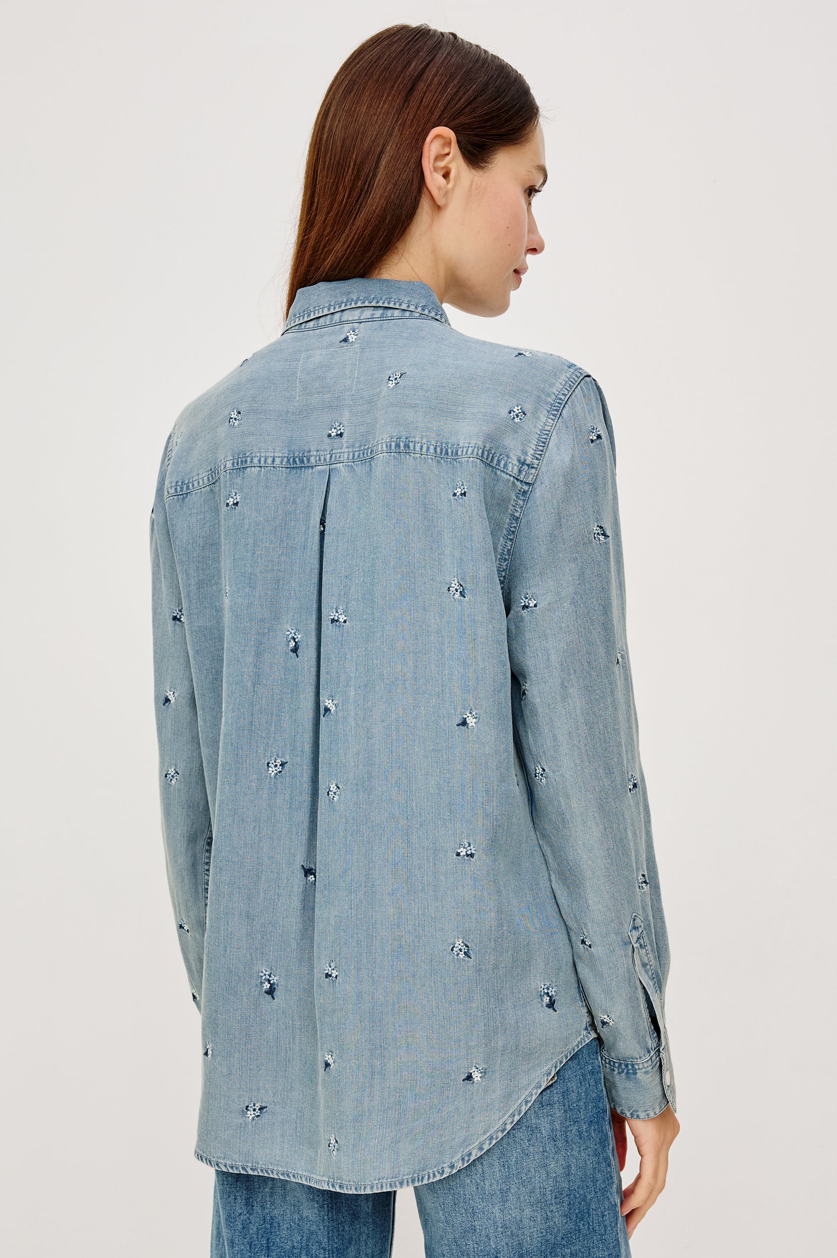Ingrid Button-Up Collared Shirt in TENCEL™Denim With Vintage-Inspired Wash, Floral Embroidery, a Chest Patch Pocket, and Long Sleeves in Blossoms Colorway - Upper Body Back View Featured on Model