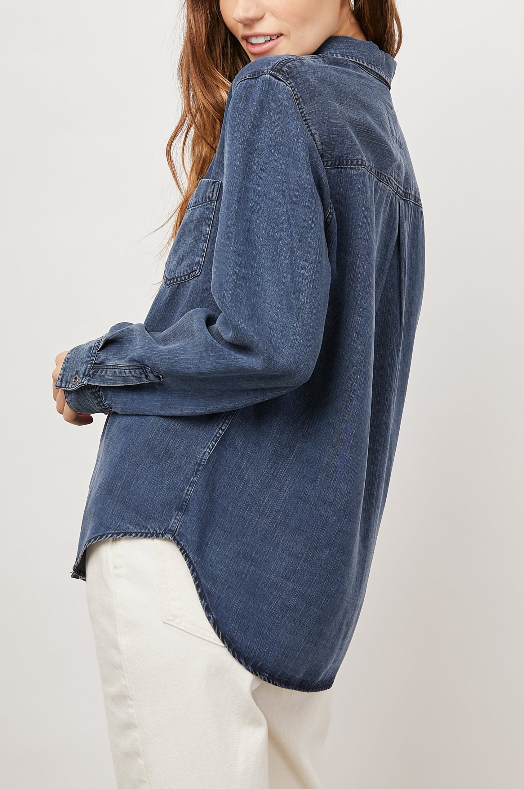 Ingrid Long Sleeve Denim Button Up with a Chest Patch Pocket in Dark Vintage Colorway - Back View Featured on Model