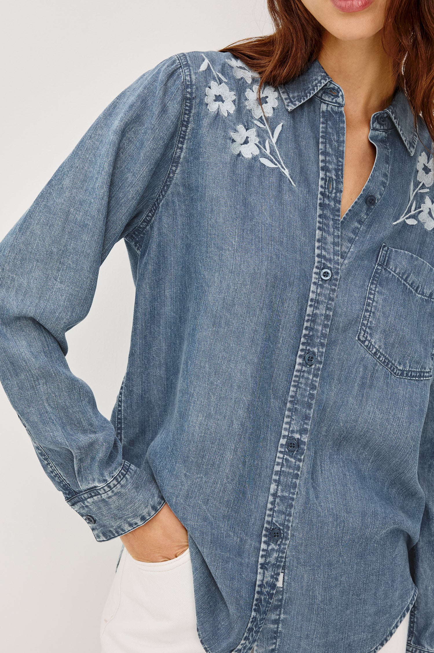 Ingrid Button-Up Collared Shirt in TENCEL™Denim With Vintage-Inspired Wash, Chest Patch Pocket, and Long Sleeves in Fleur Embroidery Colorway - Upper Body Front View Featured on Model