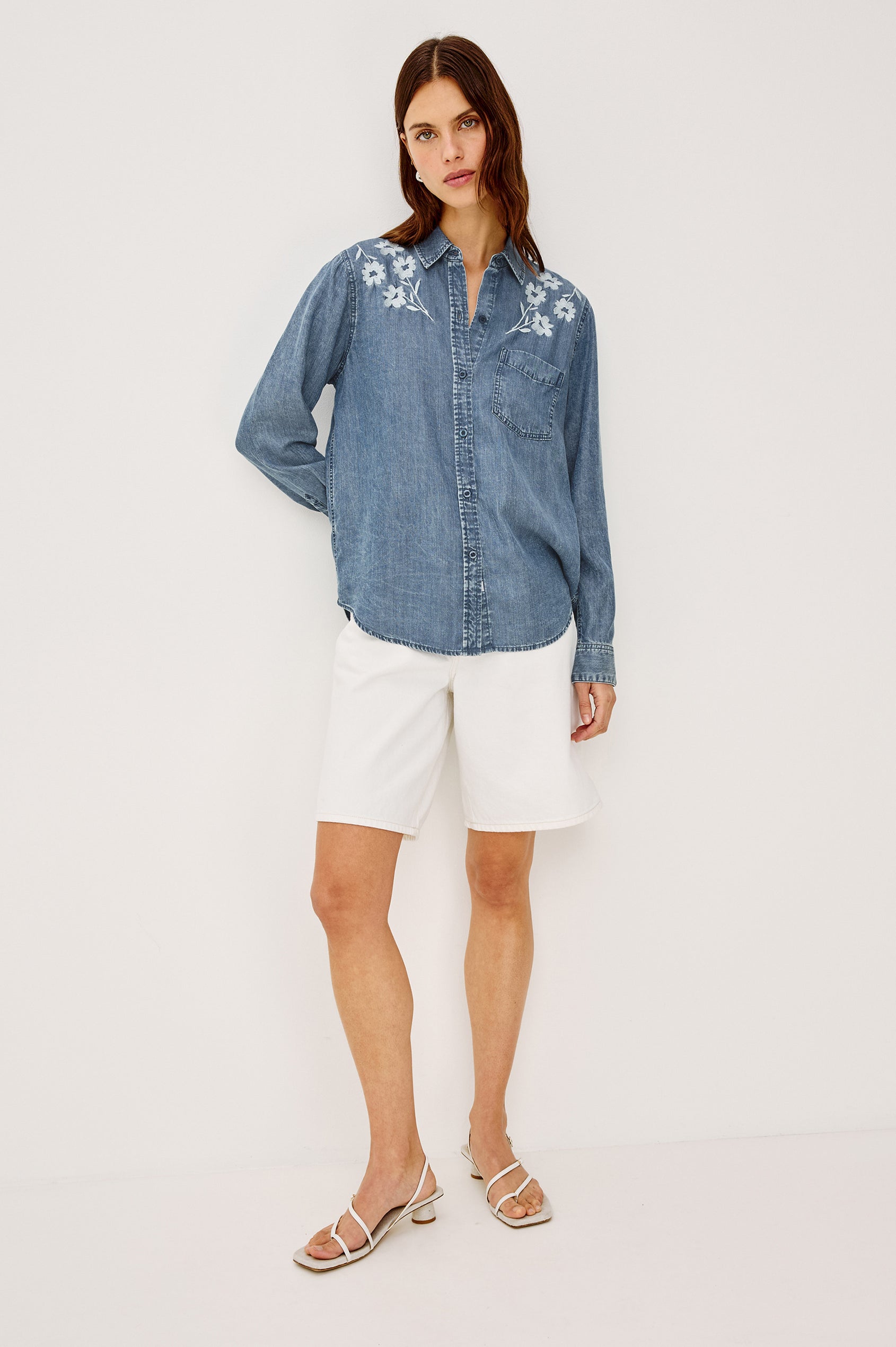 Ingrid Button-Up Collared Shirt in TENCEL™Denim With Vintage-Inspired Wash, Chest Patch Pocket, and Long Sleeves in Fleur Embroidery Colorway - Full Body Front View Featured on Model
