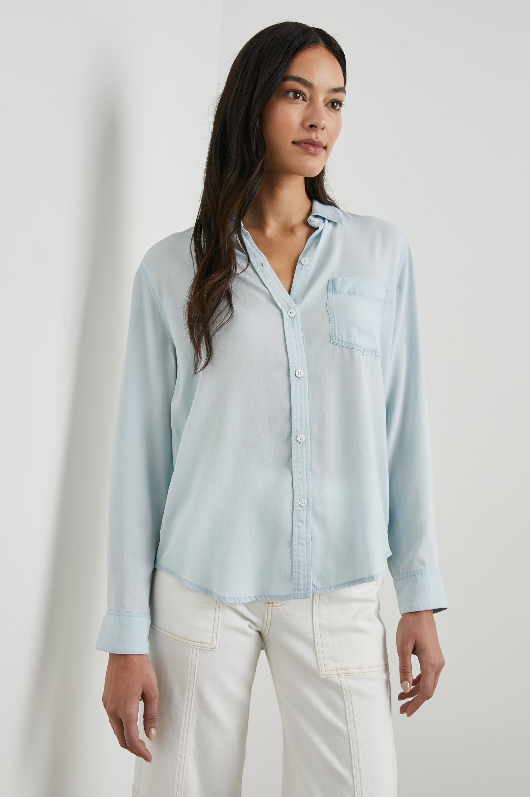 Ingrid Long Sleeve Denim Button Up with a Chest Patch Pocket in Light Vintage Colorway - Front View Featured on Model