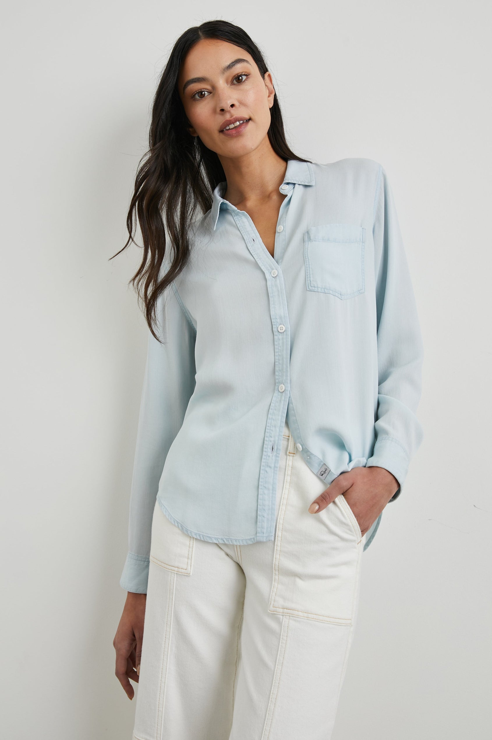 Ingrid Long Sleeve Denim Button Up with a Chest Patch Pocket in Light Vintage Colorway - Front View Featured on Model