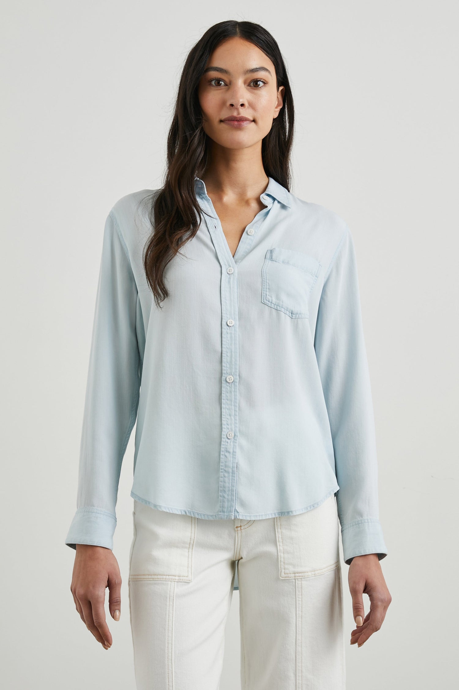 Ingrid Long Sleeve Denim Button Up with a Chest Patch Pocket in Light Vintage Colorway - Front View Featured on Model