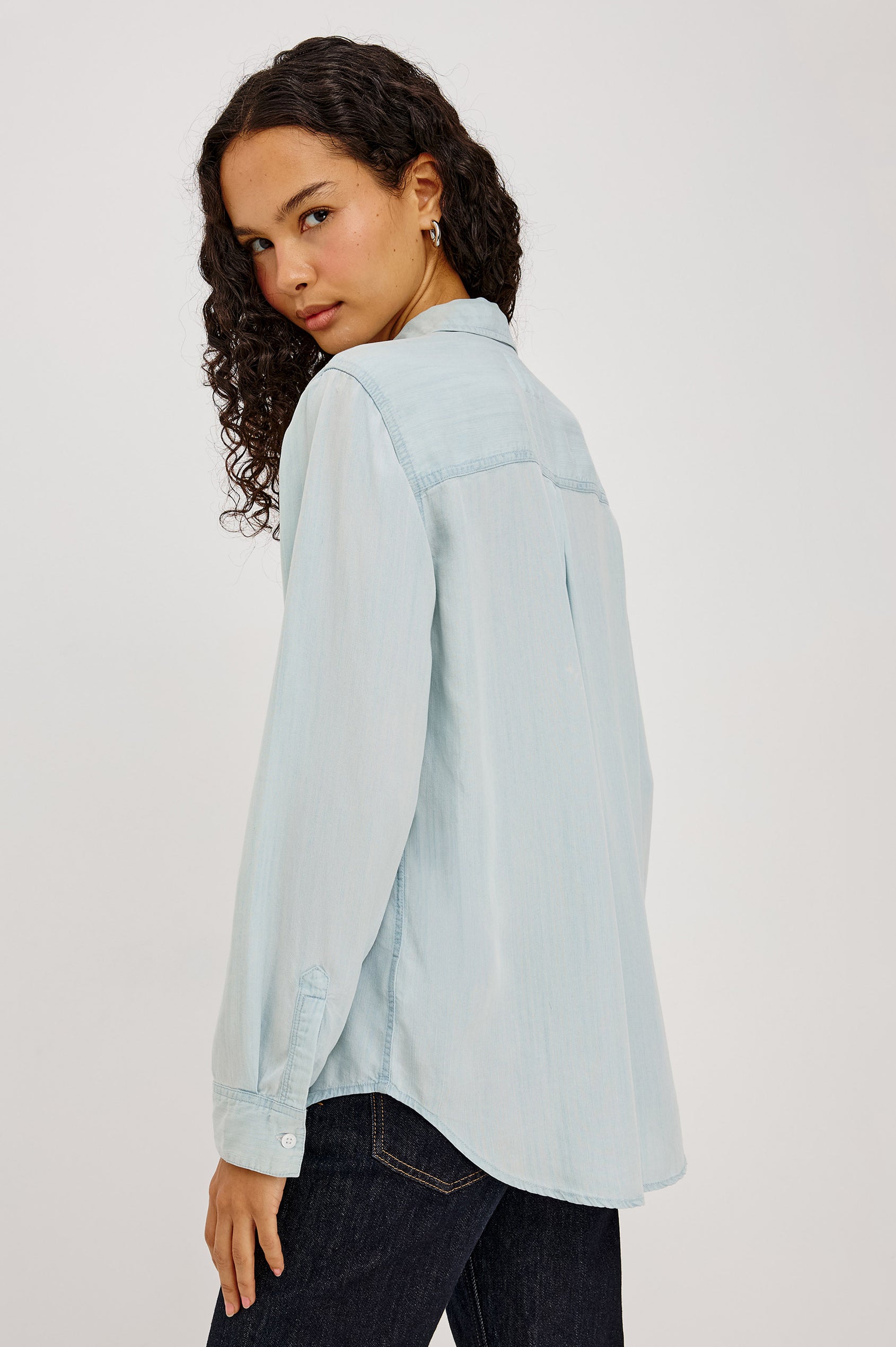 Ingrid Shirt in TENCEL™Denim With Classic Fit, Front Buttons, Chest Patch Pocket, and Long Sleeves in Light Vintage Colorway - Upper Body Back View Featured on Model