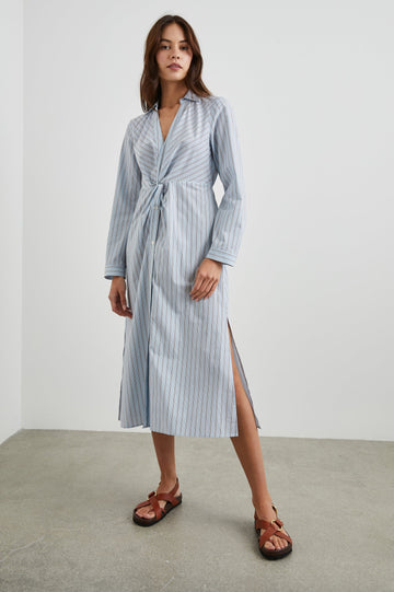 Irie Long-Sleeve Midi Dress with an Overlapped V Neck, Buttons Down the Skirt, a Side Thigh Slit, a Collar and a Seam at the Waist in Hampton Stripe Colorway, Black and White Diagonal and Vertical Stripes on Light Blue - Front Full Body View Featured on Model 