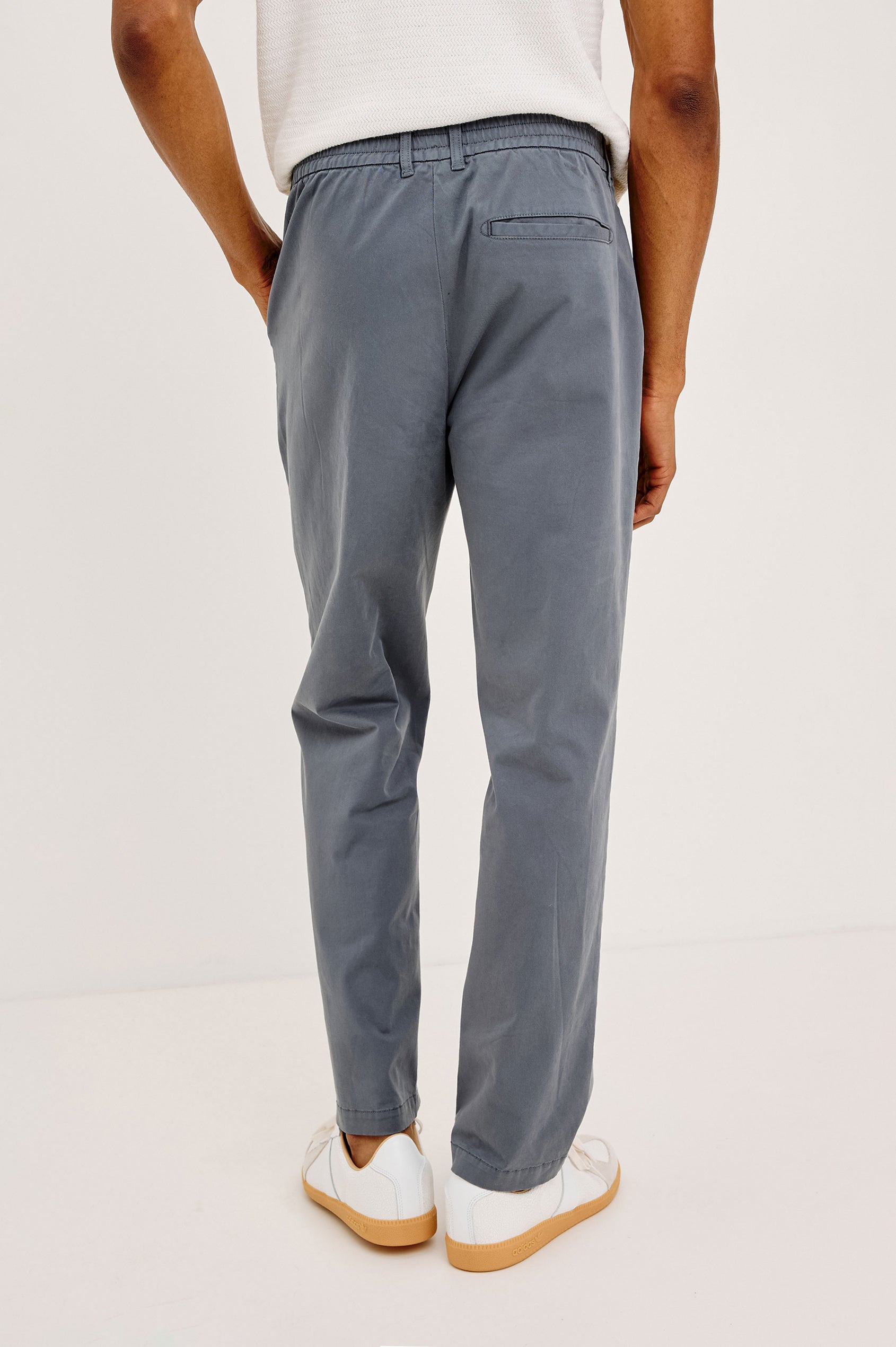 Irving Slim Straight Pant With Side Slant Pockets and Back Welt Pockets in Ensign Blue Colorway - Lower Body Back View Featured on Model