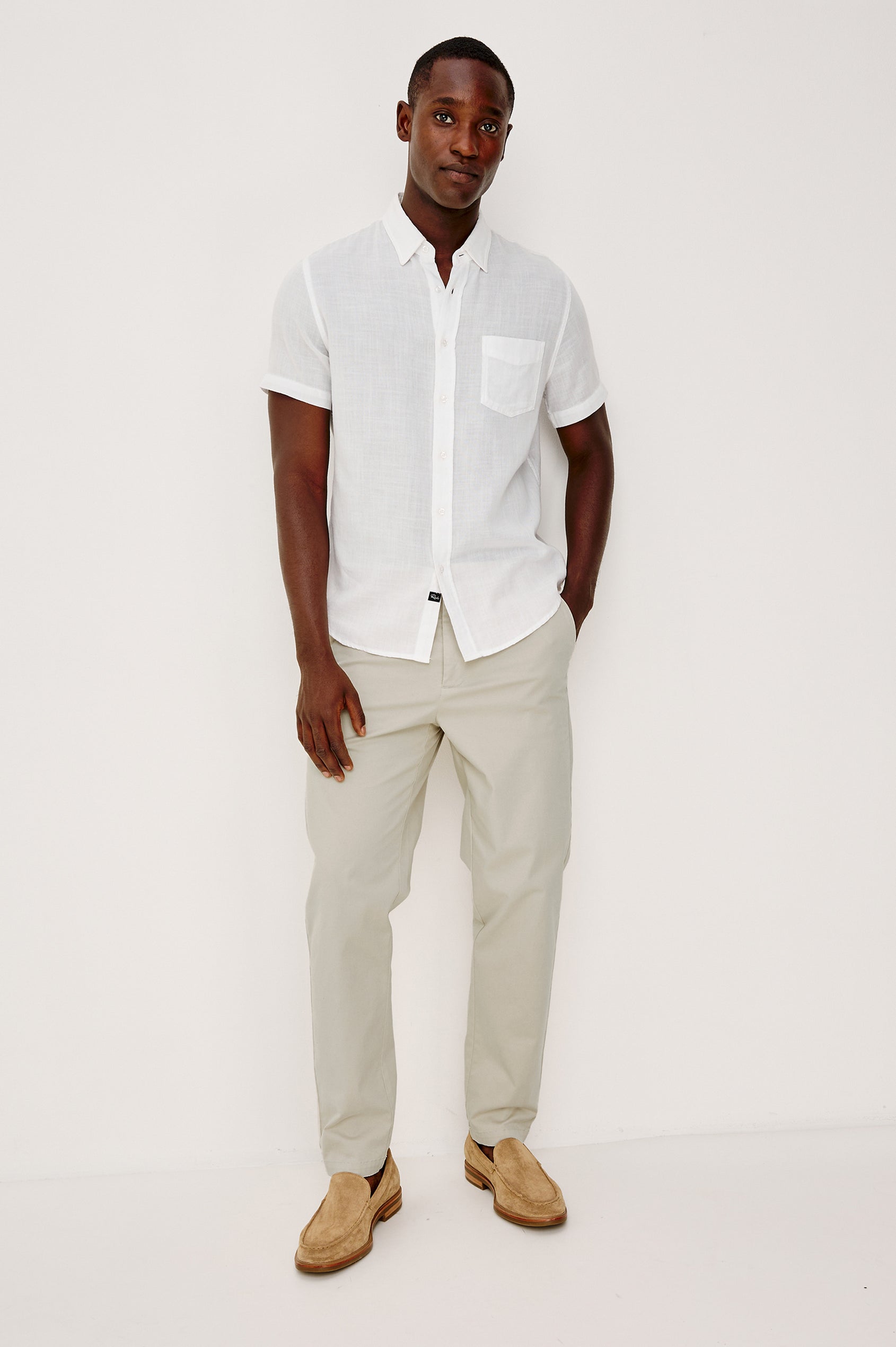 Irving Slim Straight Pant With Side Slant Pockets, and Back Welt Pockets in Stone Colorway - Full Body Back View Featured on Model