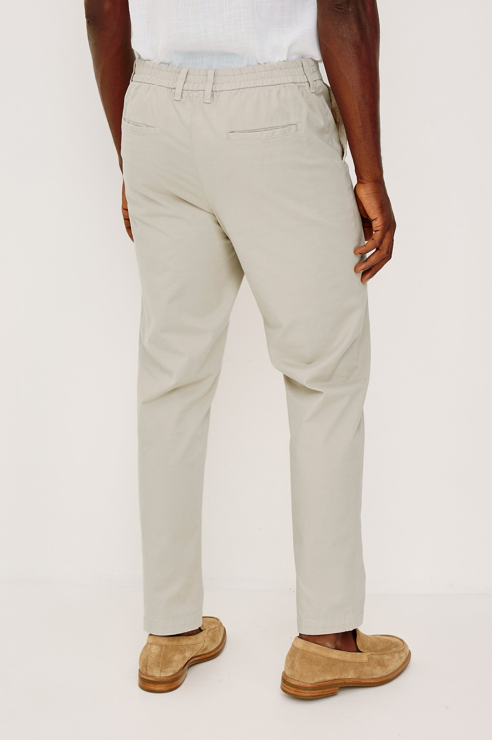 Irving Slim Straight Pant With Side Slant Pockets, and Back Welt Pockets in Stone Colorway - Lower Body Back View Featured on Model