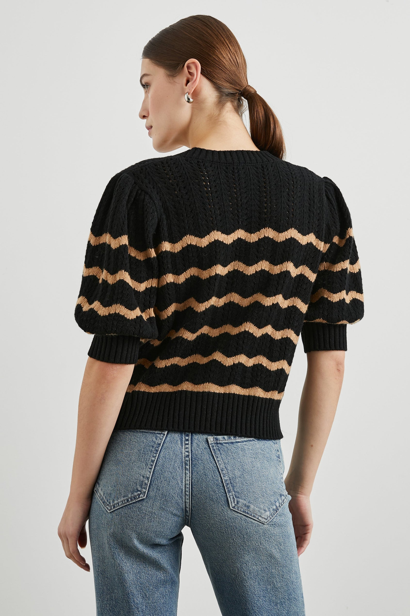 Isla Mid-length-Sleeve Cardigan with Ribbed Hems and Cuffs and Button Closure in Black Camel Stripe Colorway, Horizontal Wavy Stripes - Back View Featured on Model