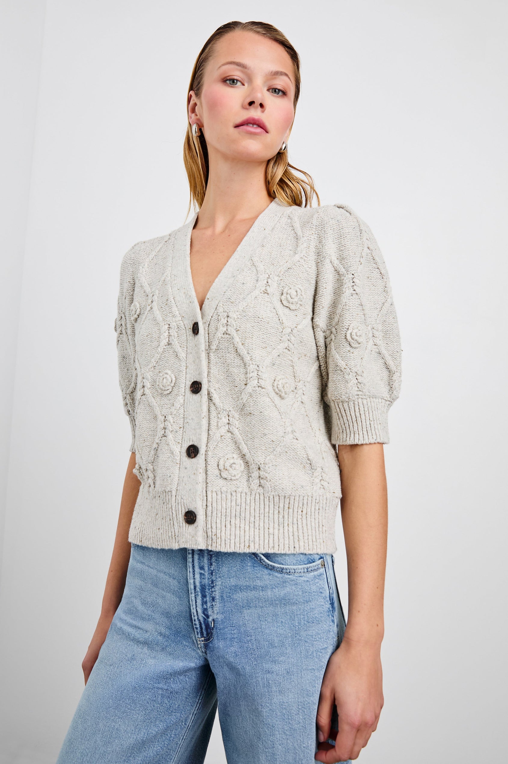 Isla Mid-length-Sleeve Cardigan with Ribbed Hems and Cuffs and Button Closure in Grey with Crochet Daisies Colorway - Front View Featured on Model