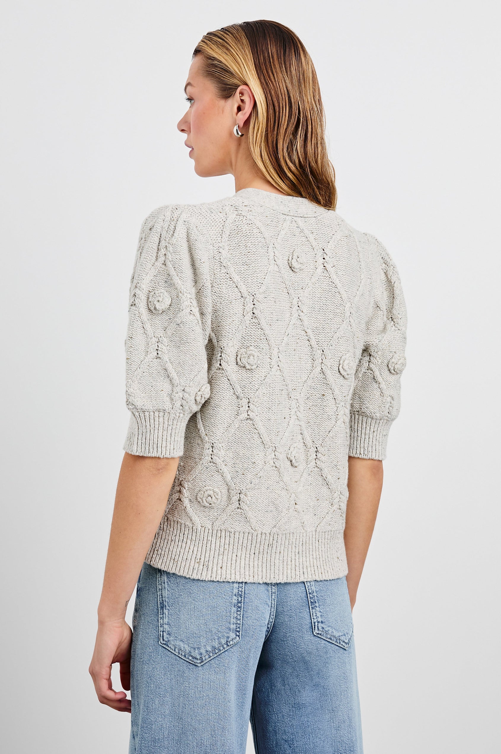 Isla Mid-length-Sleeve Cardigan with Ribbed Hems and Cuffs and Button Closure in Grey with Crochet Daisies Colorway - Back View Featured on Model