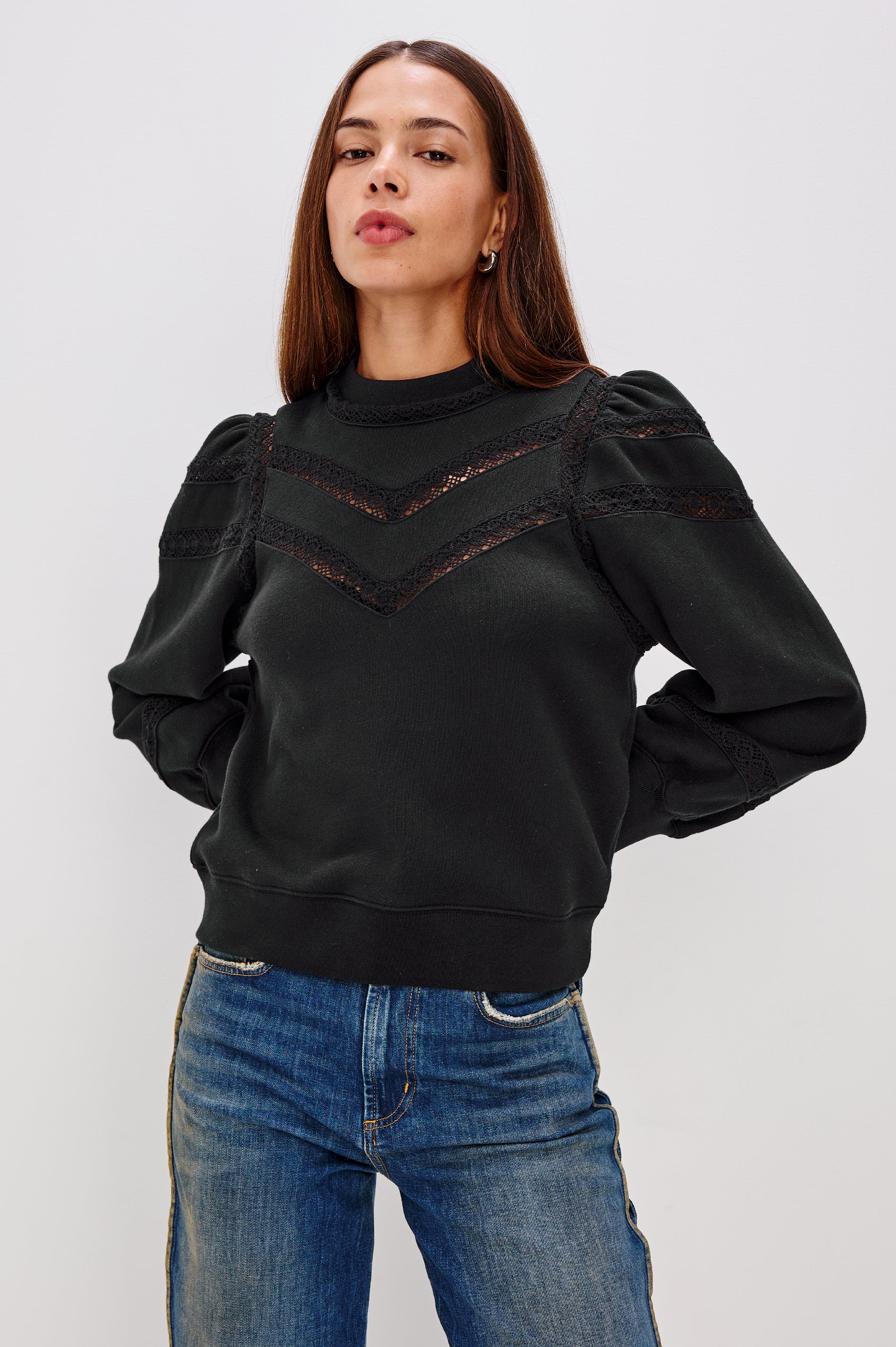 Isles Sweatshirt in French Terry With Sheer Embroidered Trim, a Mockneck, Long Puff Sleeves, and Ribbed Trim in Black Colorway - Upper Body Front View Featured on Model