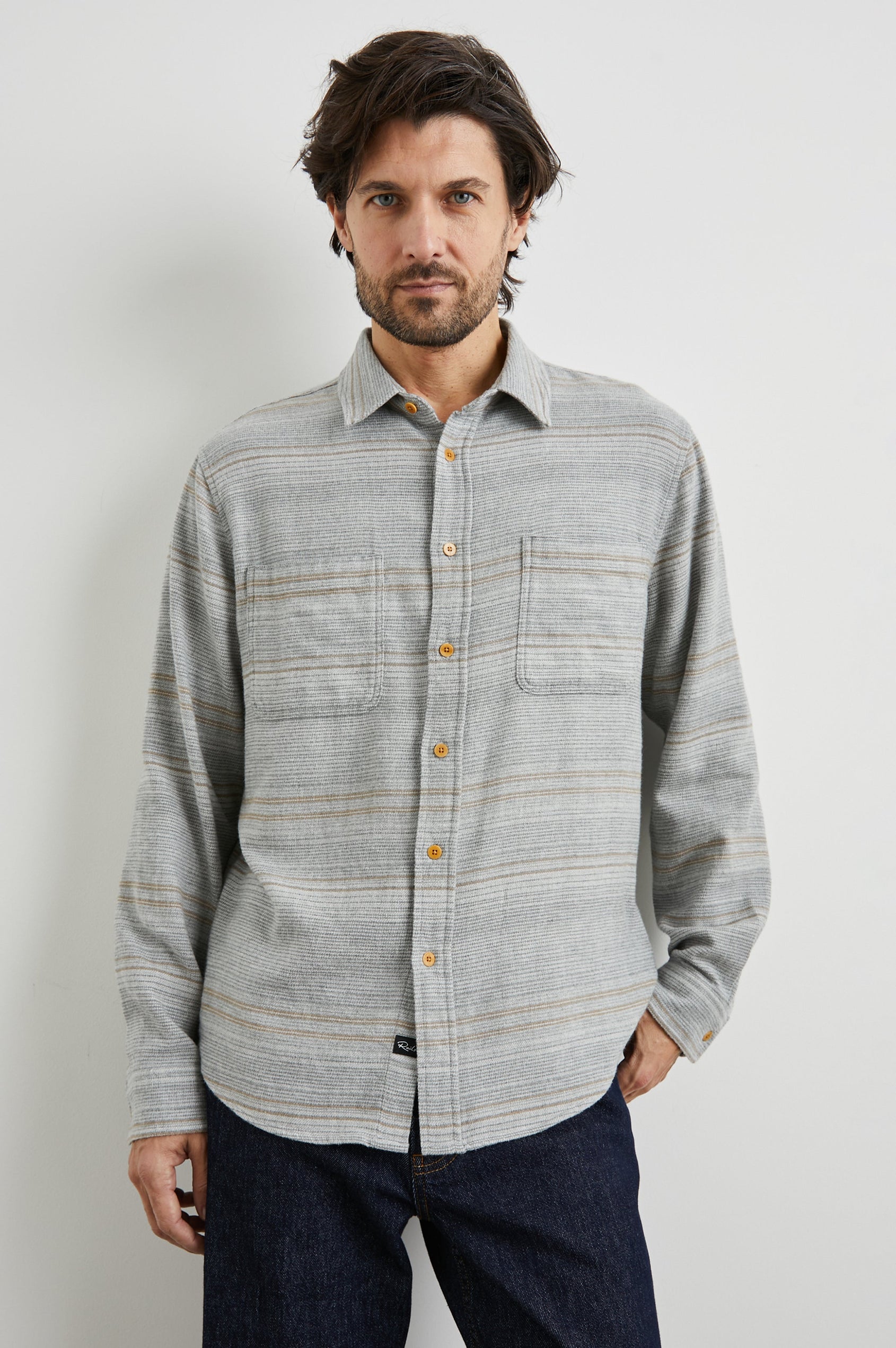 Ivan Long-Sleeve Button Up with Two Chest Patch Pockets in Grey Serape Colorway, with horizontal stripes in browns and greys on Grey - Front View Featured on Model