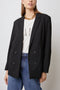 Jac Double-Breasted Blazer with Two Front Flap Pockets and a Notched Label in Black Twill Colorway - Front View Featured on Model