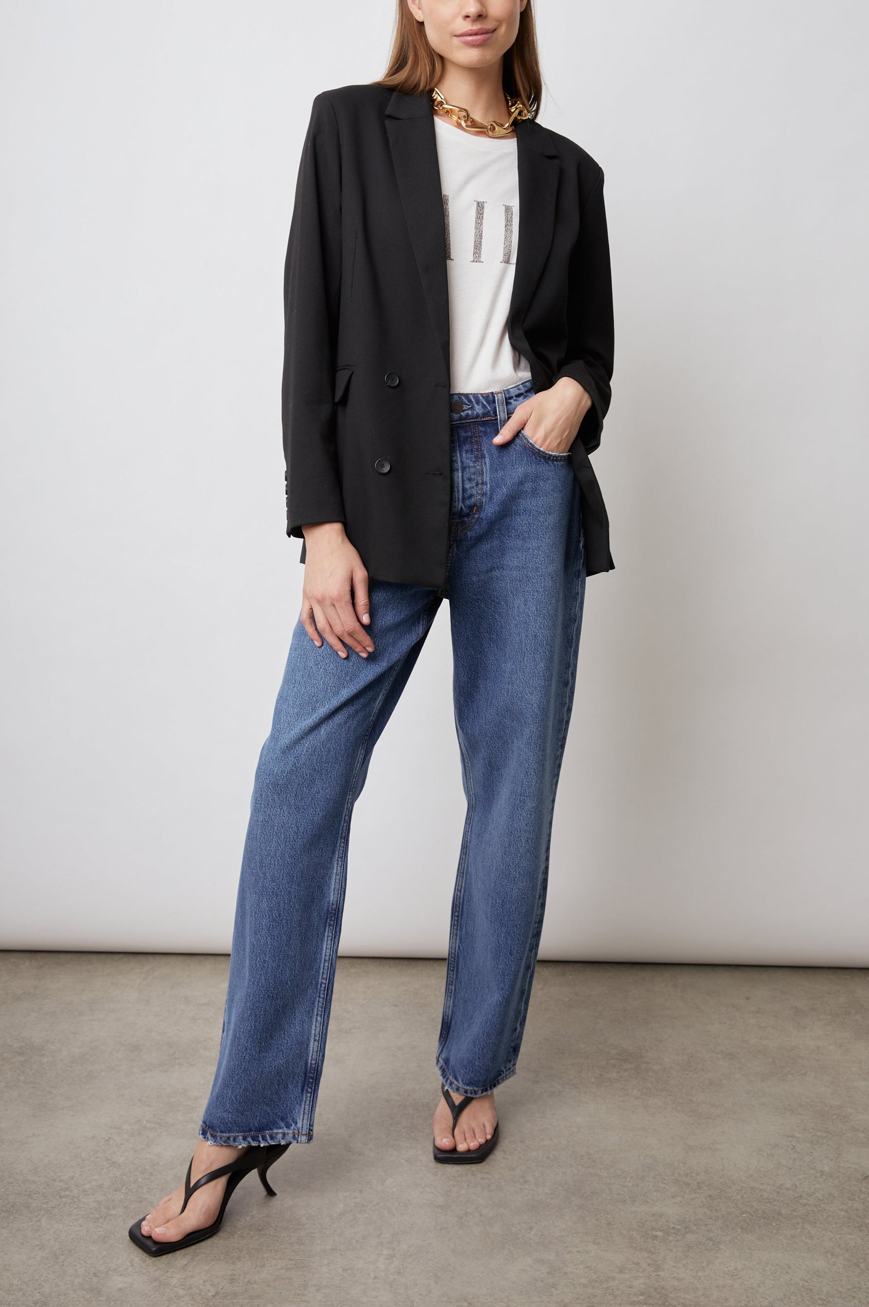 Jac Double-Breasted Blazer with Two Front Flap Pockets and a Notched Label in Black Twill Colorway - Front Full Body View Featured on Model