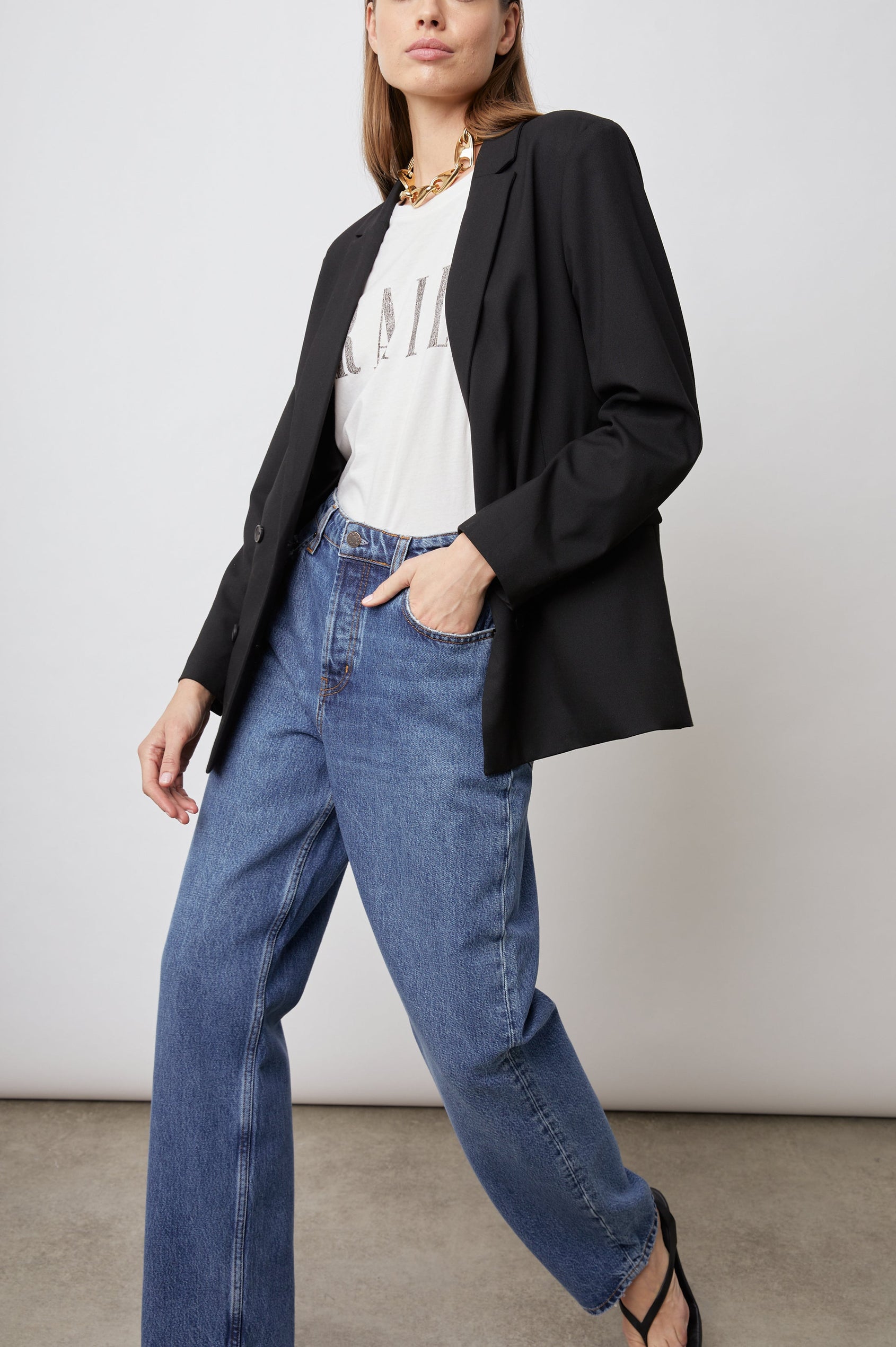 Jac Double-Breasted Blazer with Two Front Flap Pockets and a Notched Label in Black Twill Colorway - Front Full Body View Featured on Model