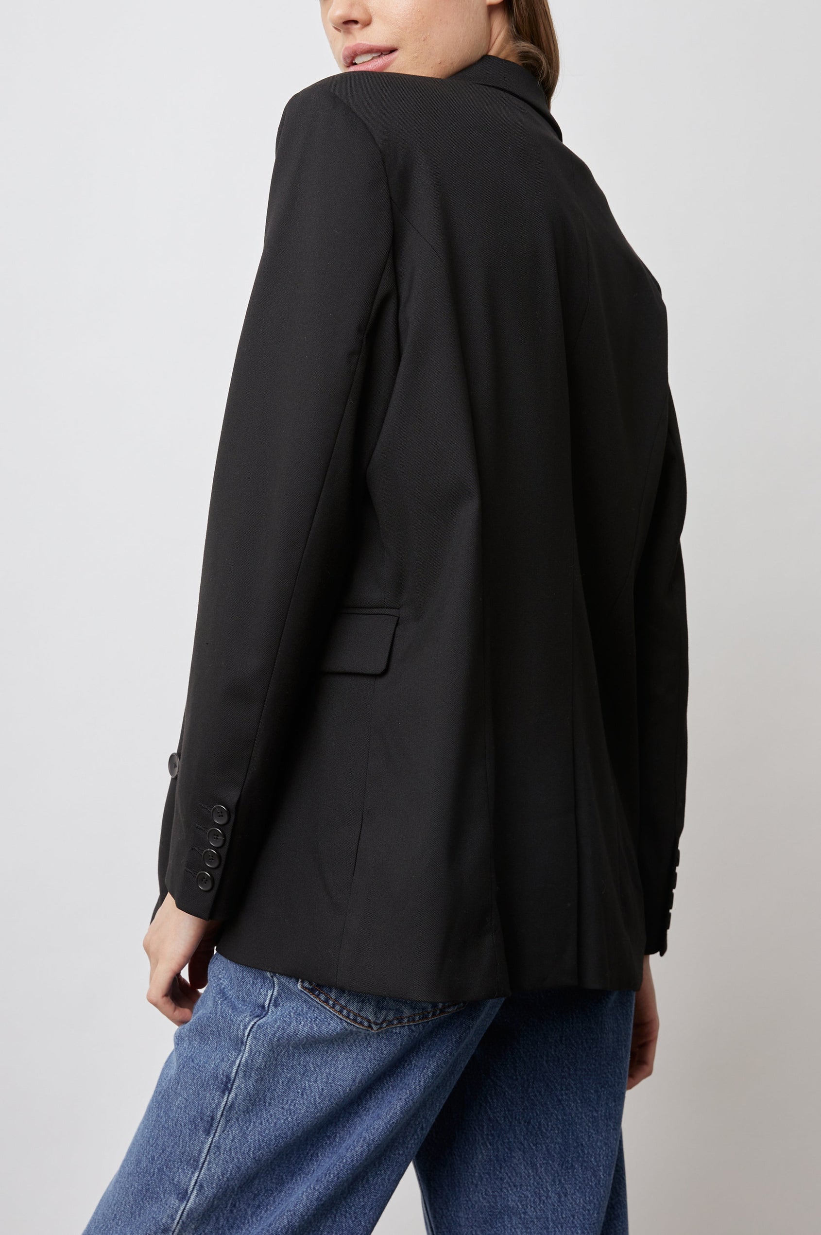 Jac Double-Breasted Blazer with Two Front Flap Pockets and a Notched Label in Black Twill Colorway - Back View Featured on Model