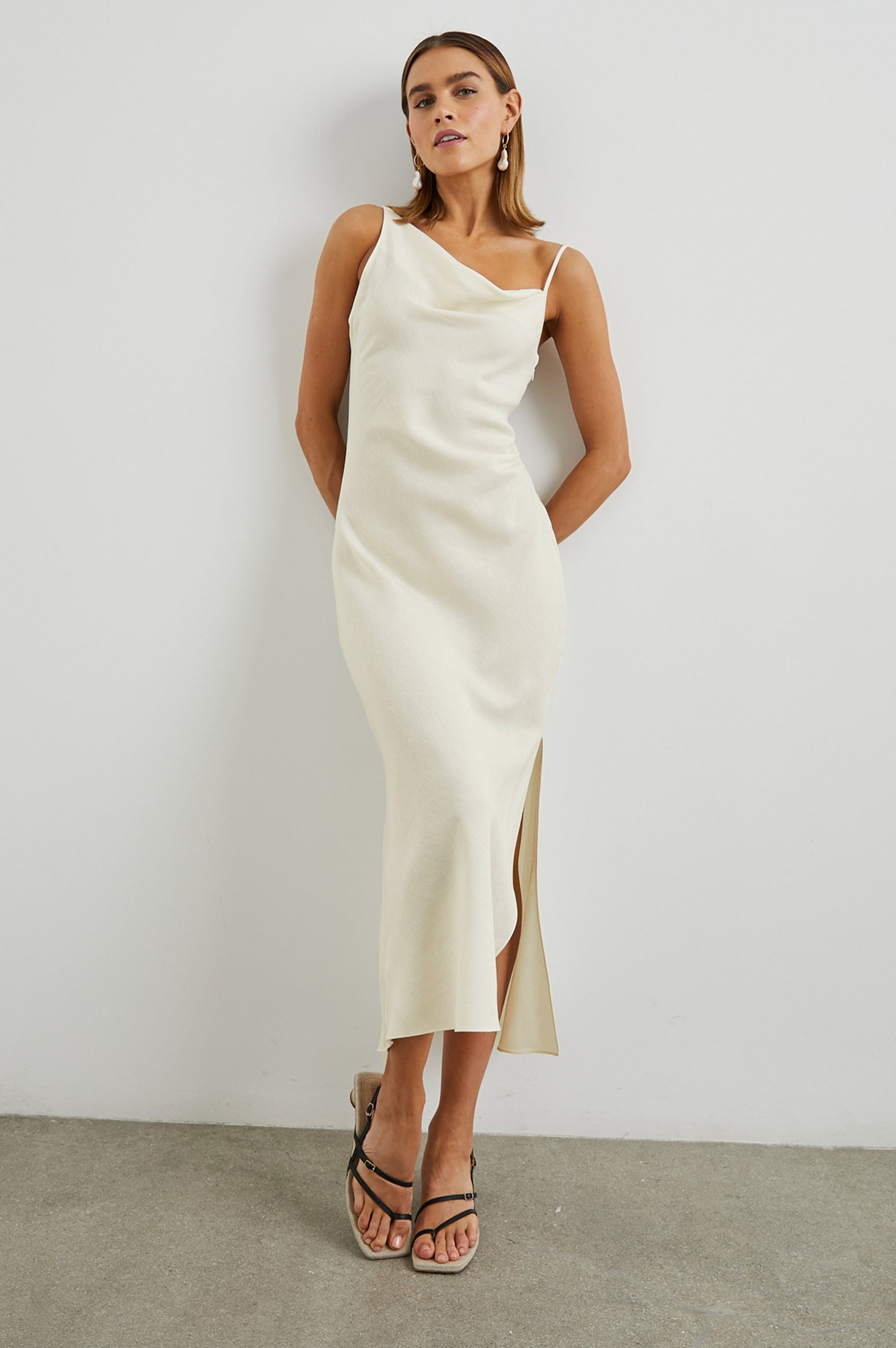 Lotus Sleeveless Midi Dress with an Asymmetrical Cowl Neck, Adjustable Back Spaghetti Straps, a Side Slit, Light Ruching on one Bodice Side in Lotus Colorway - Front Full Body View Featured on Model