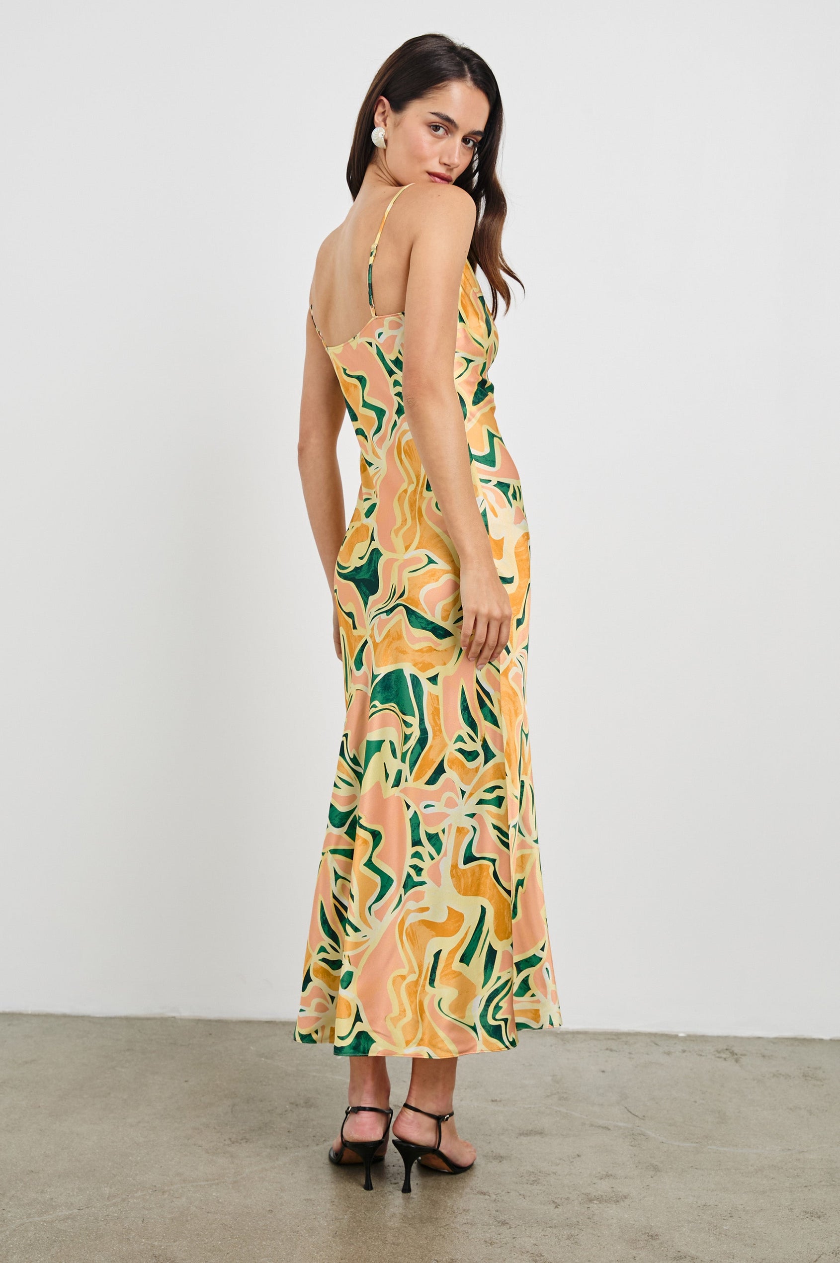 Jackie Midi Cowl Neck Dress with Asymmetrical Spaghetti Straps and a Curved Side Slit in Tulum Colorway. Full Body Back View Shown on Model.