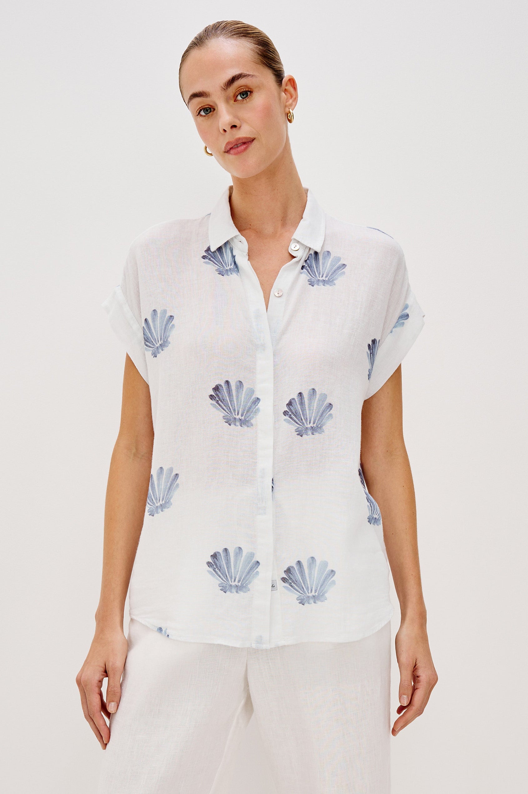 Jaime Collared Button Front Shirt with Short Cuffed Sleeves and Blue Seashells Colorway. Front View Shown on Model. 