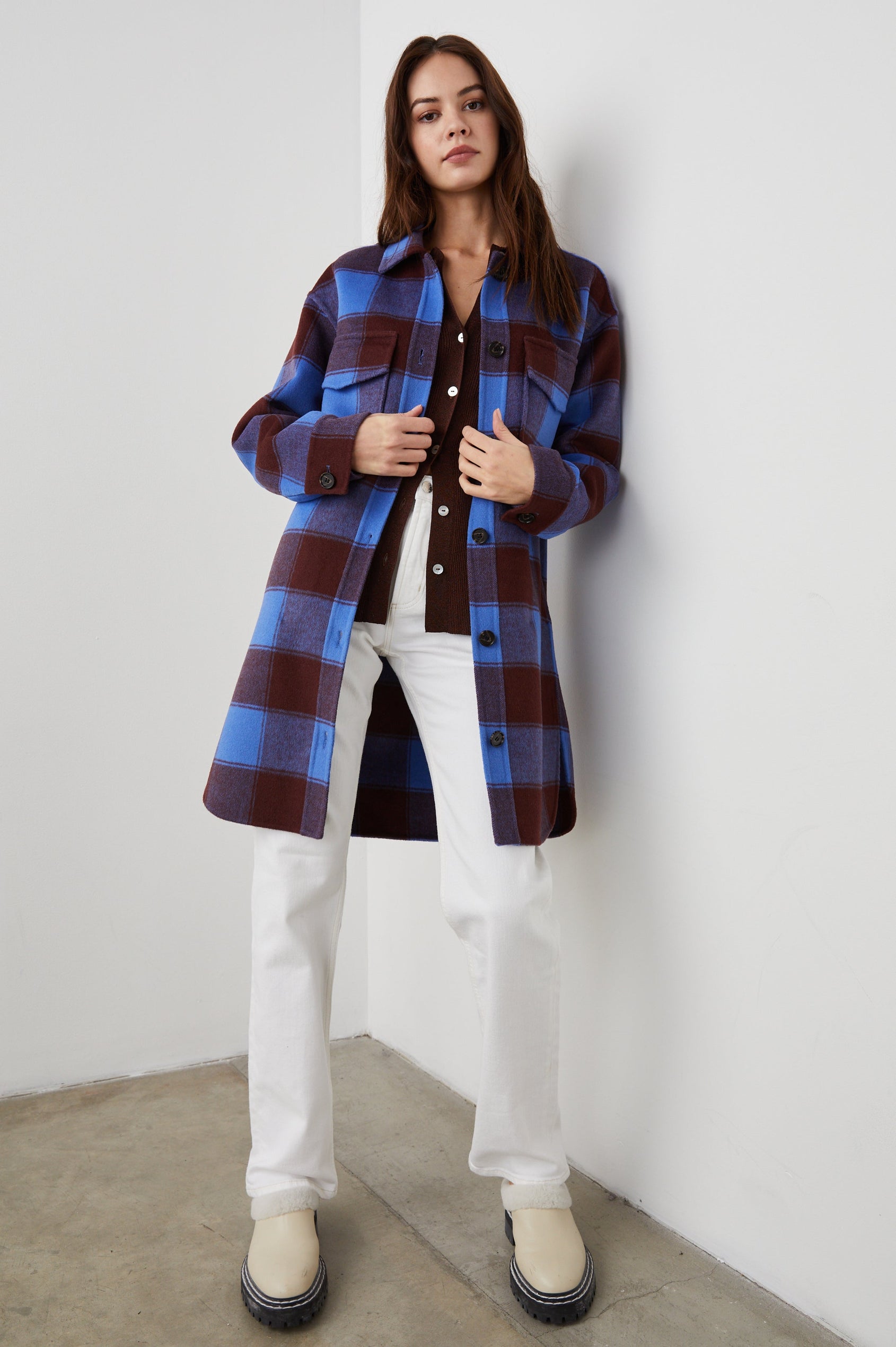 Jaro Mid-Thigh Length Coat with Button Closure, Button Cuffs, Two Chest Flap Pockets, Two Front Pockets and Side Hem Slits in Cobalt Chocolate Colorway, a Plaid - Front Full Body View Featured on Model 