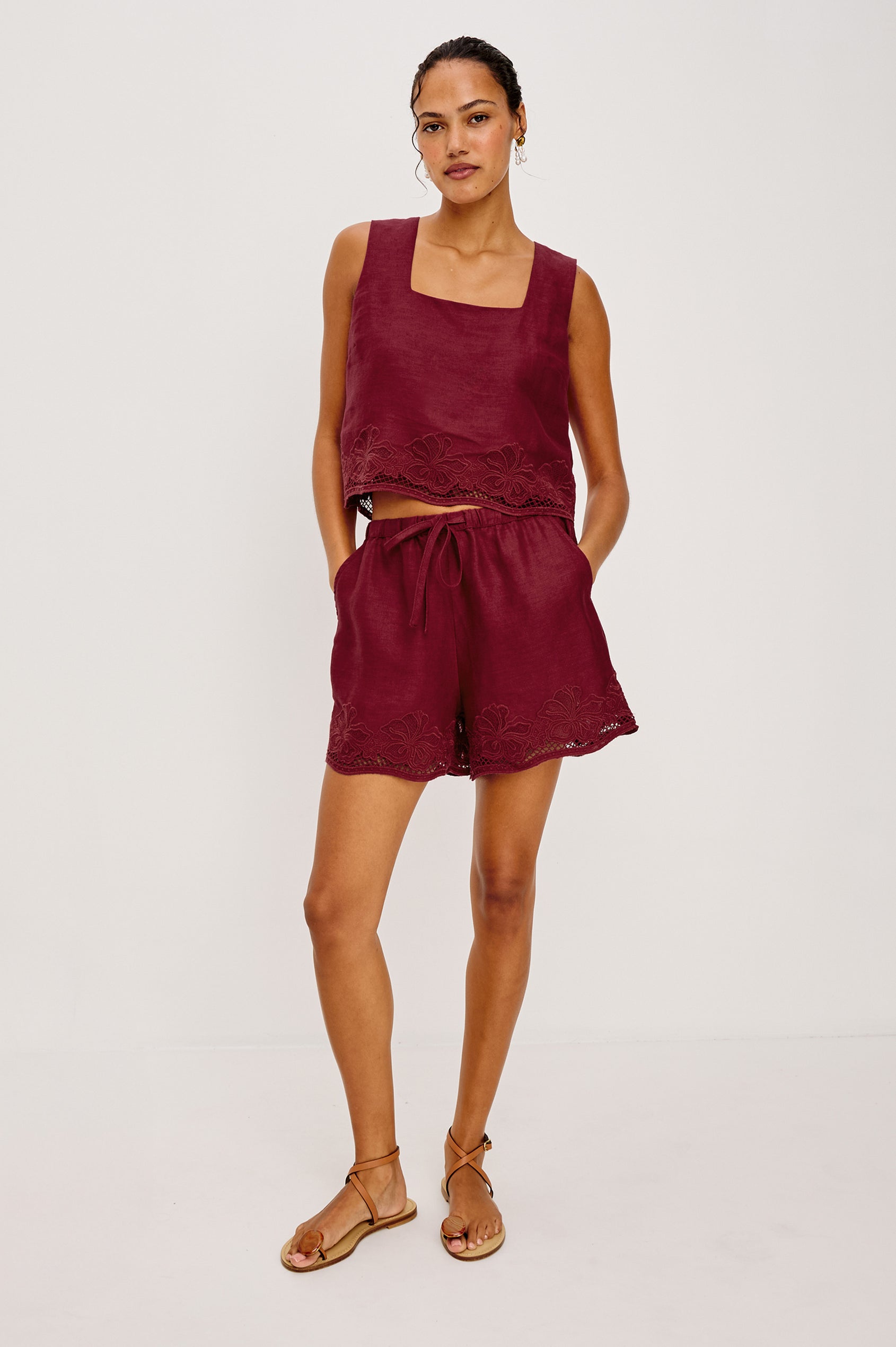 Jenner High-Waisted Short in Unlined Linen With Adjsutable Drawstring Waist TIes Side Pockets and Relaxed Fit in Berry Hibiscus Embroidery Colorway - Upper Body Front View Featured on Model