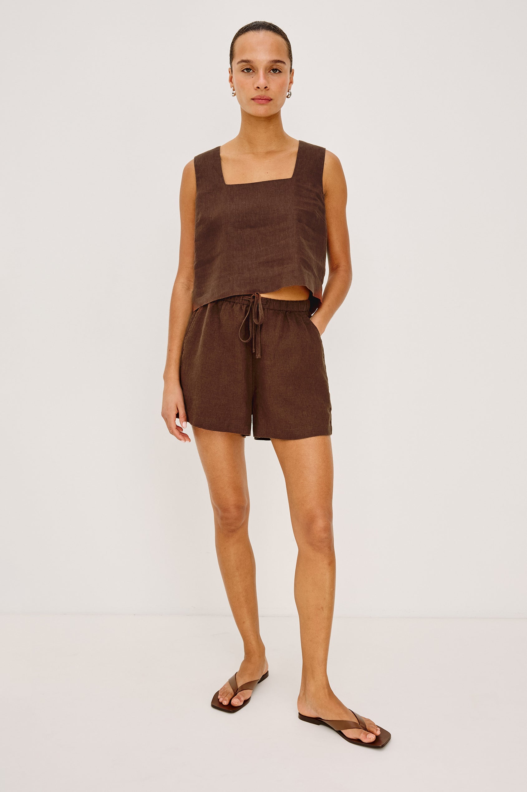 Jenner High-Waisted Short in Unlined Linen With Adjsutable Drawstring Waist TIes, Side Pockets, and Relaxed Fit in Espresso Colorway - Full Body Front View Featured on Model