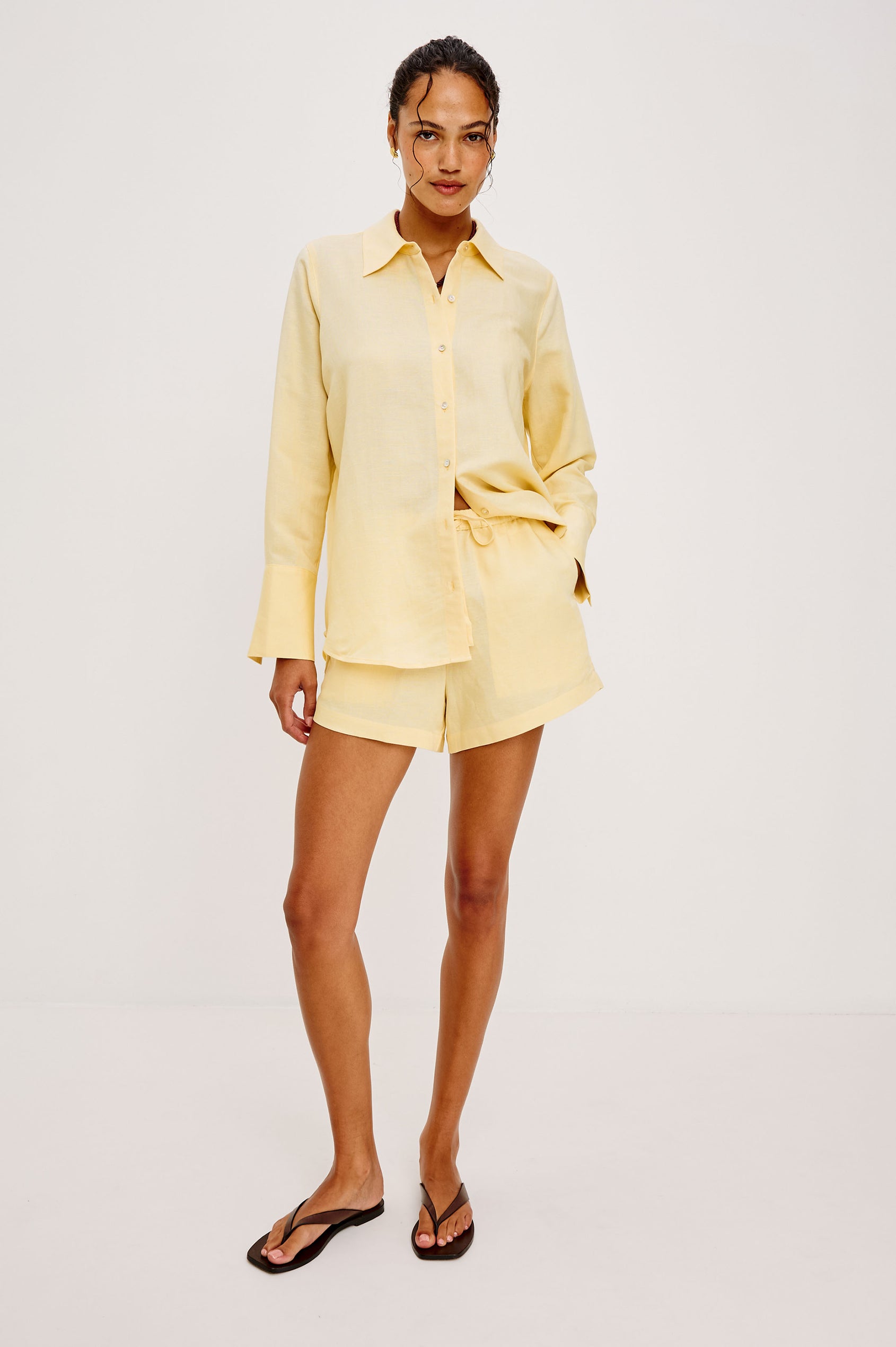Jenner High-Waisted Short in Unlined Linen With Adjustable Drawstring Waist TIes, Side Pockets, and Relaxed Fit in Sunshine Colorway - Full Body Front View Featured on Model