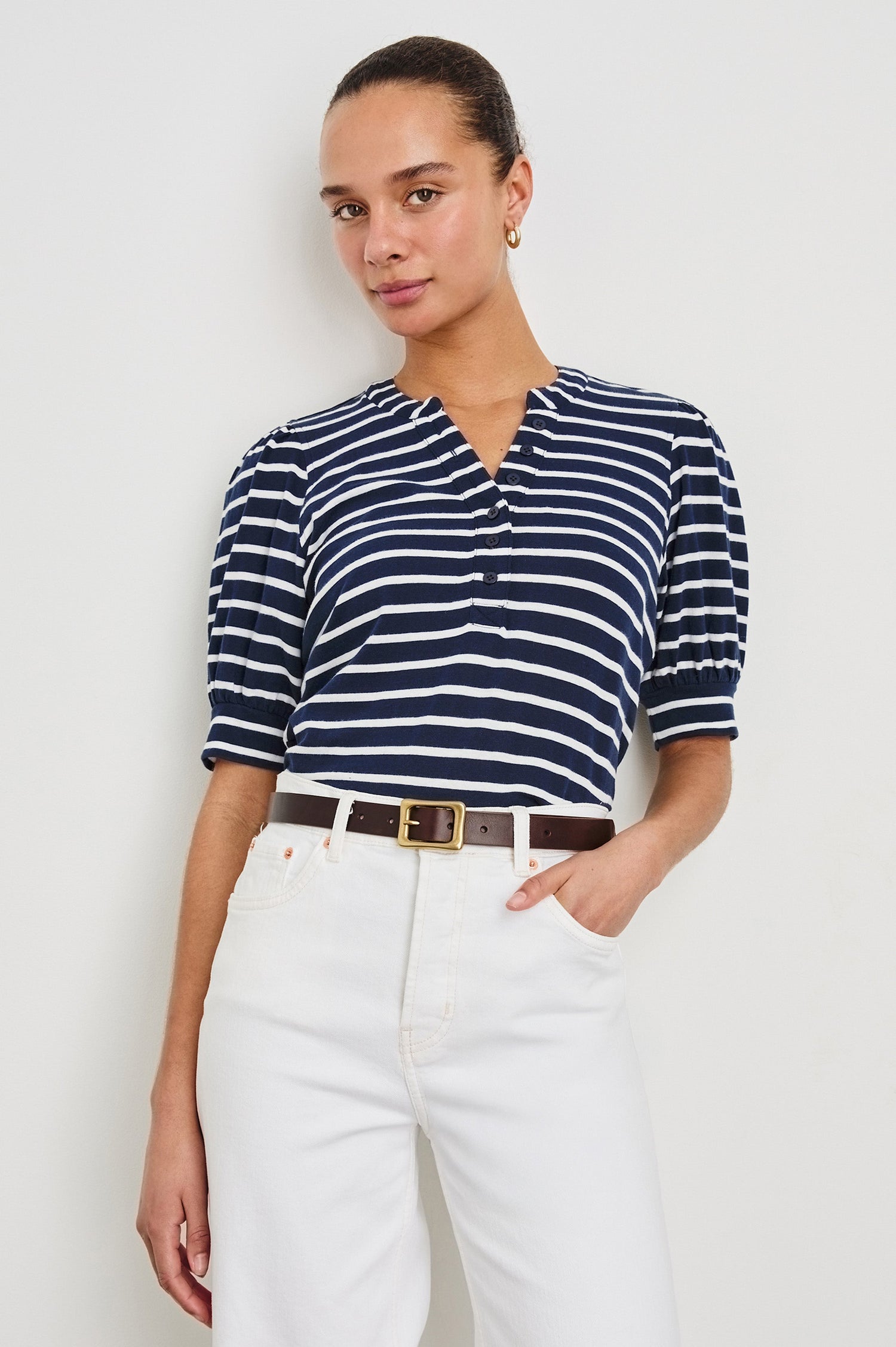Jewel Puff Short Sleeve With Quarter Down Buttons In Colorway Navy Ivory Stripe - front view on model, tucked in with belt